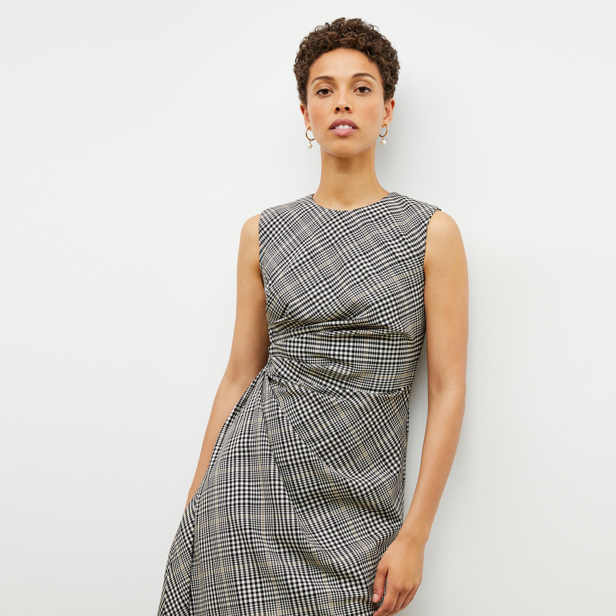 Front image of a woman wearing the jeannine dress in plaid sharkskin
