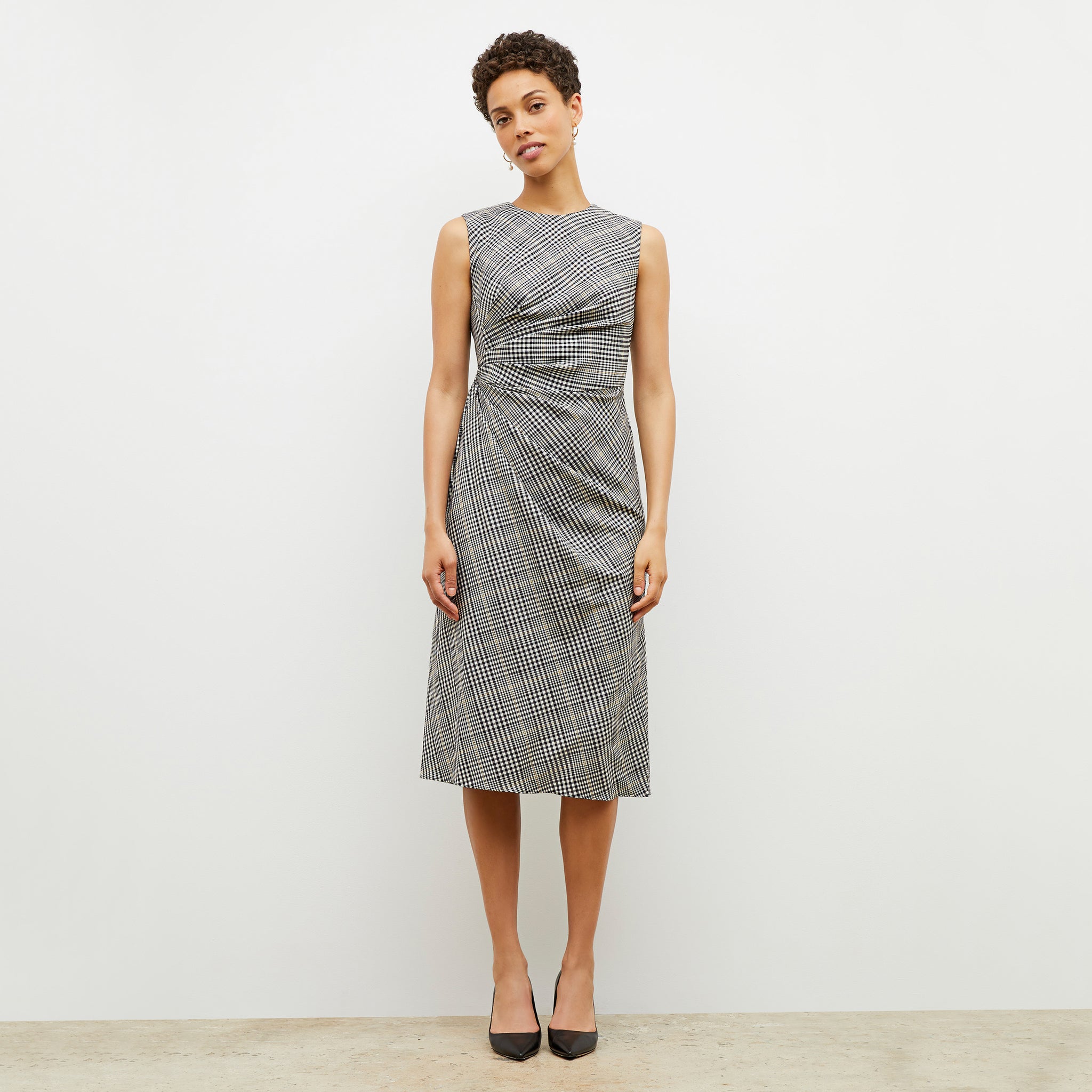 Front image of a woman wearing the jeannine dress in plaid sharkskin 