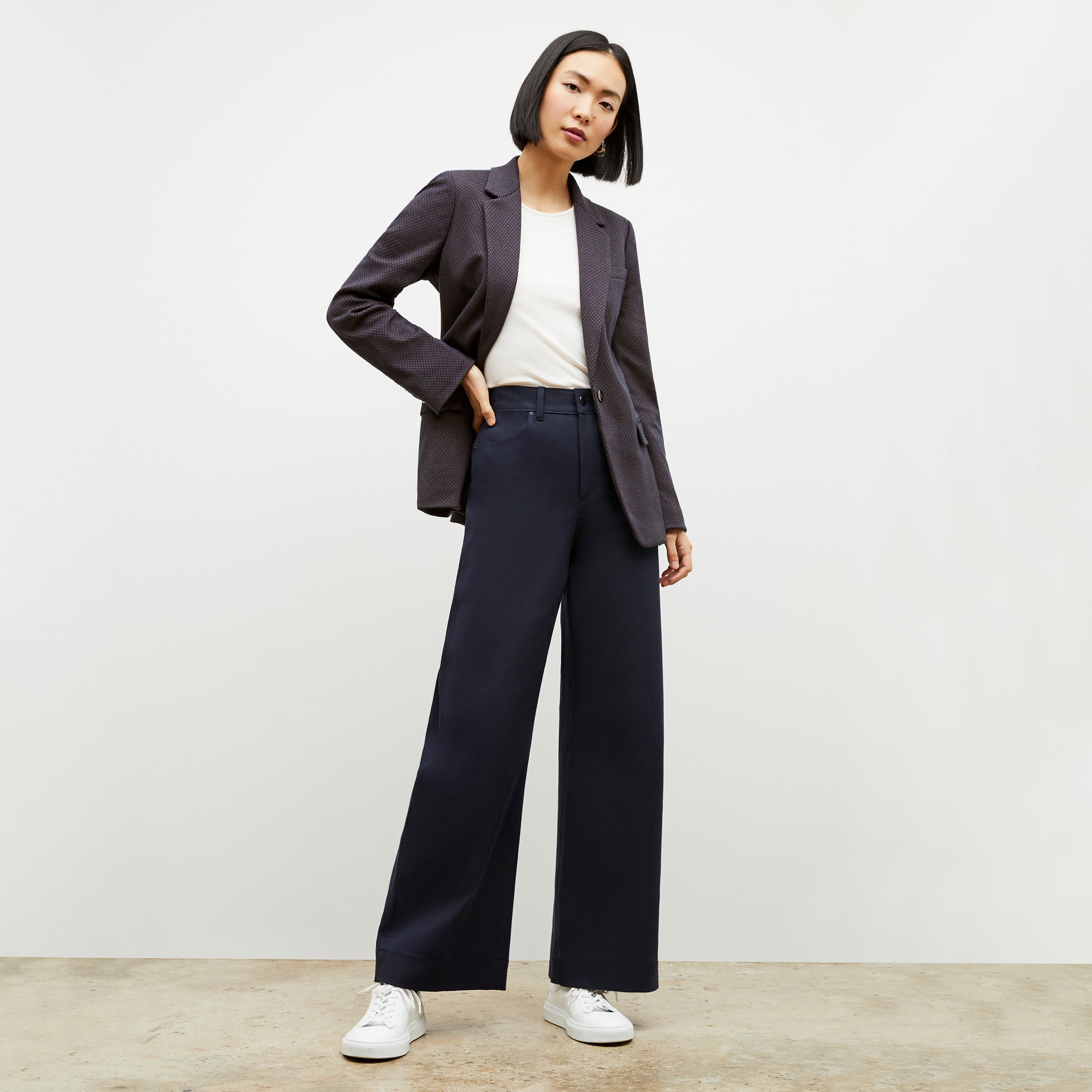 Front image of a woman wearing the yiyan blazer in navy multi