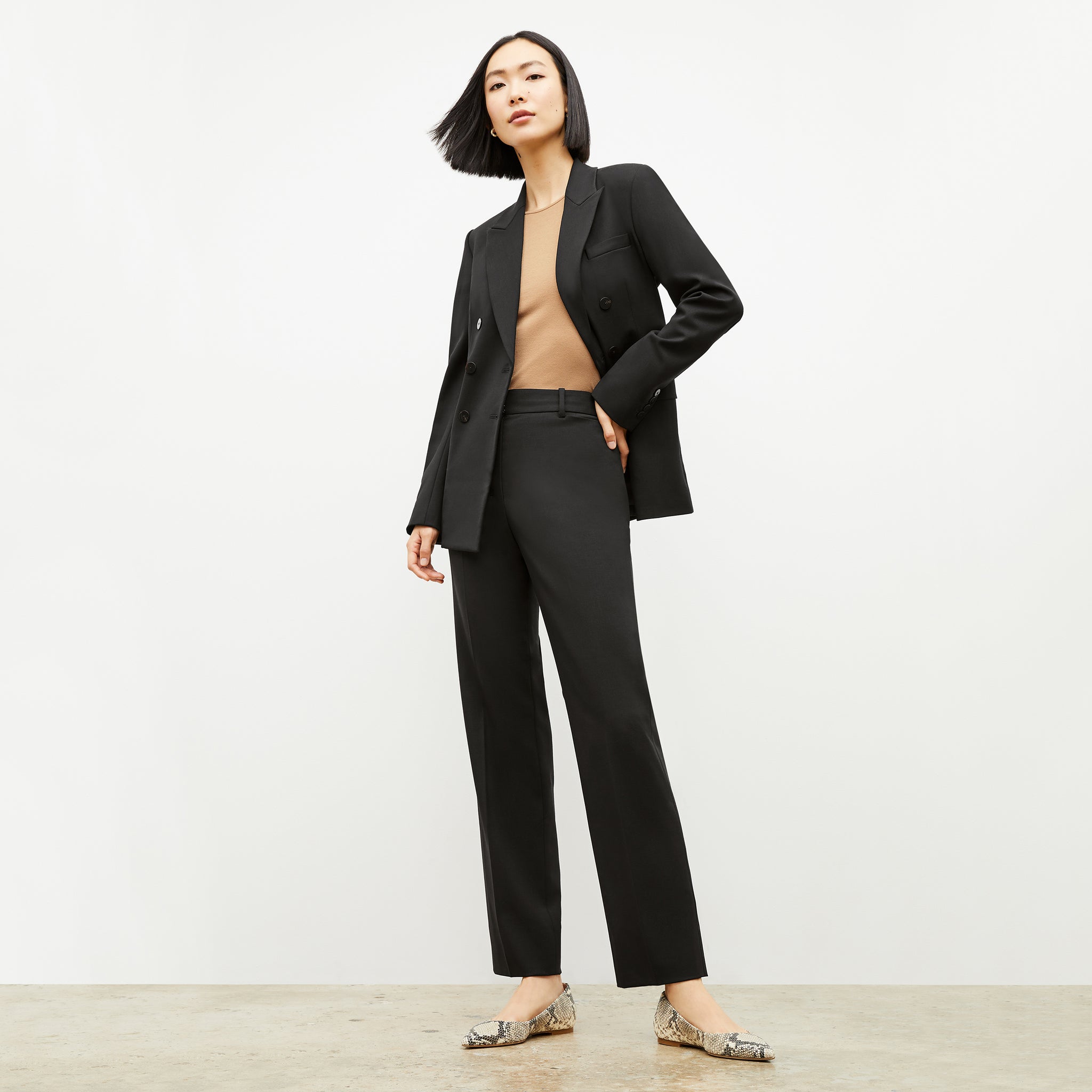 Front image of a woman wearing the smith pant in black 