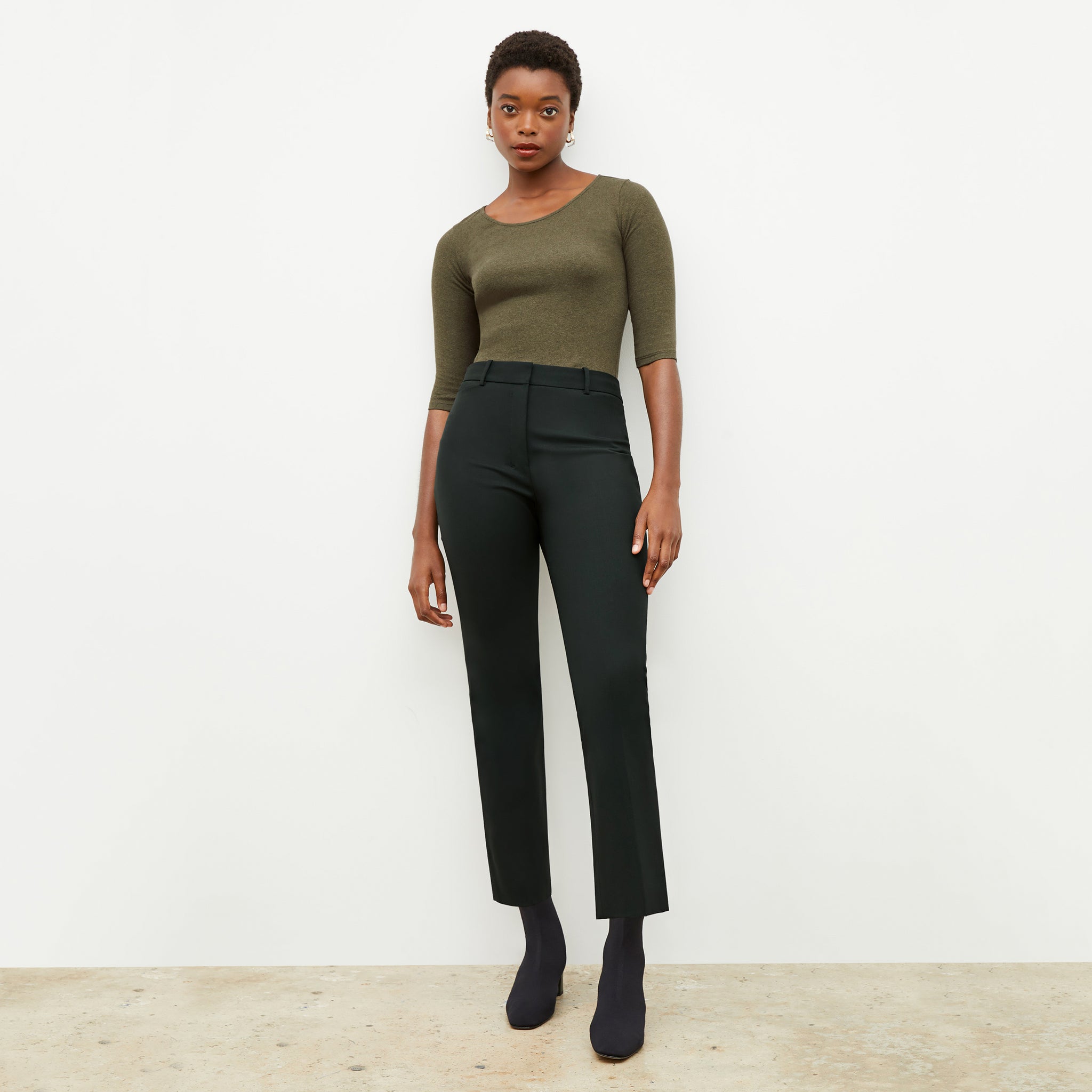 Front image of a woman wearing the smith pant in forest