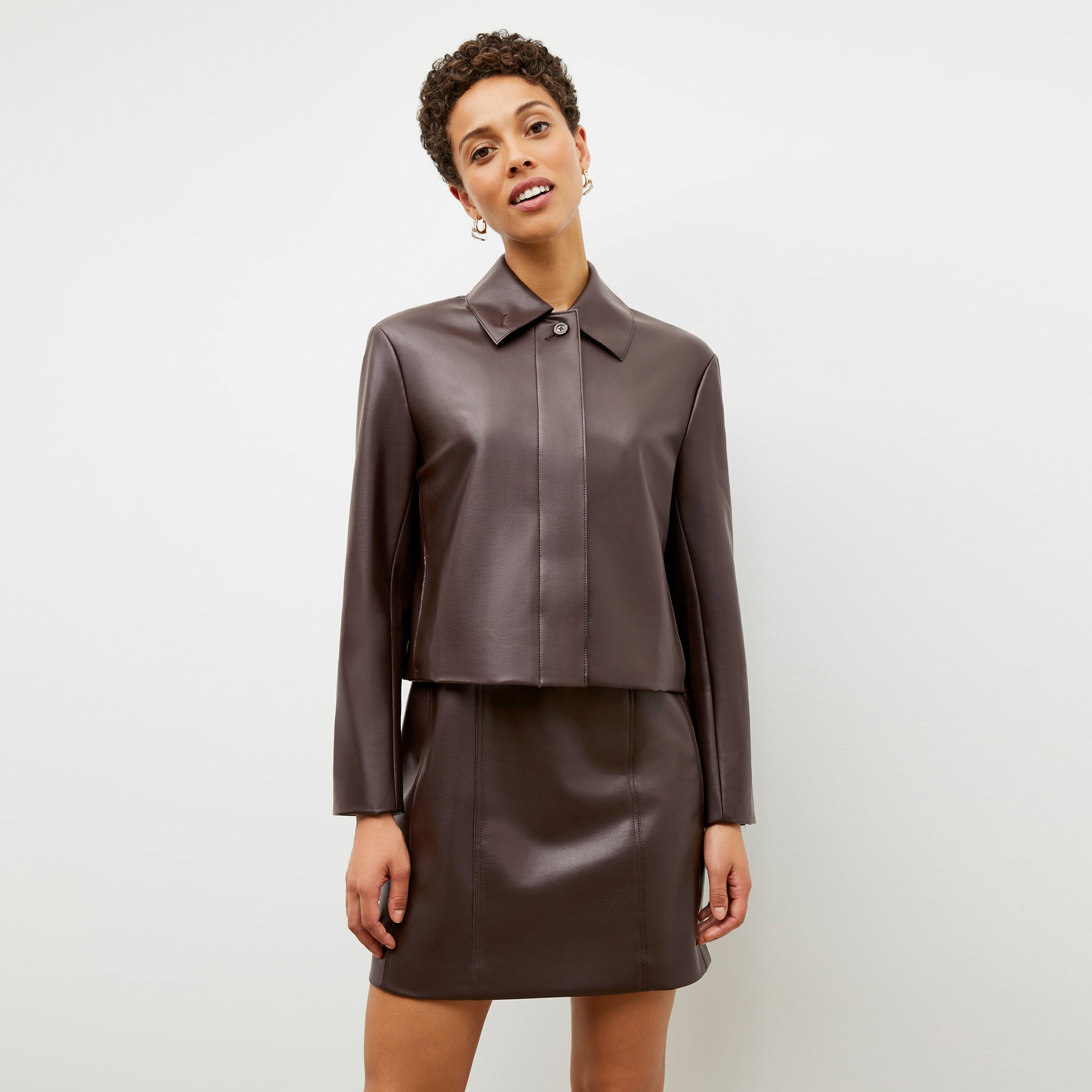 Front image of a woman wearing the Chloe Dress in Brown