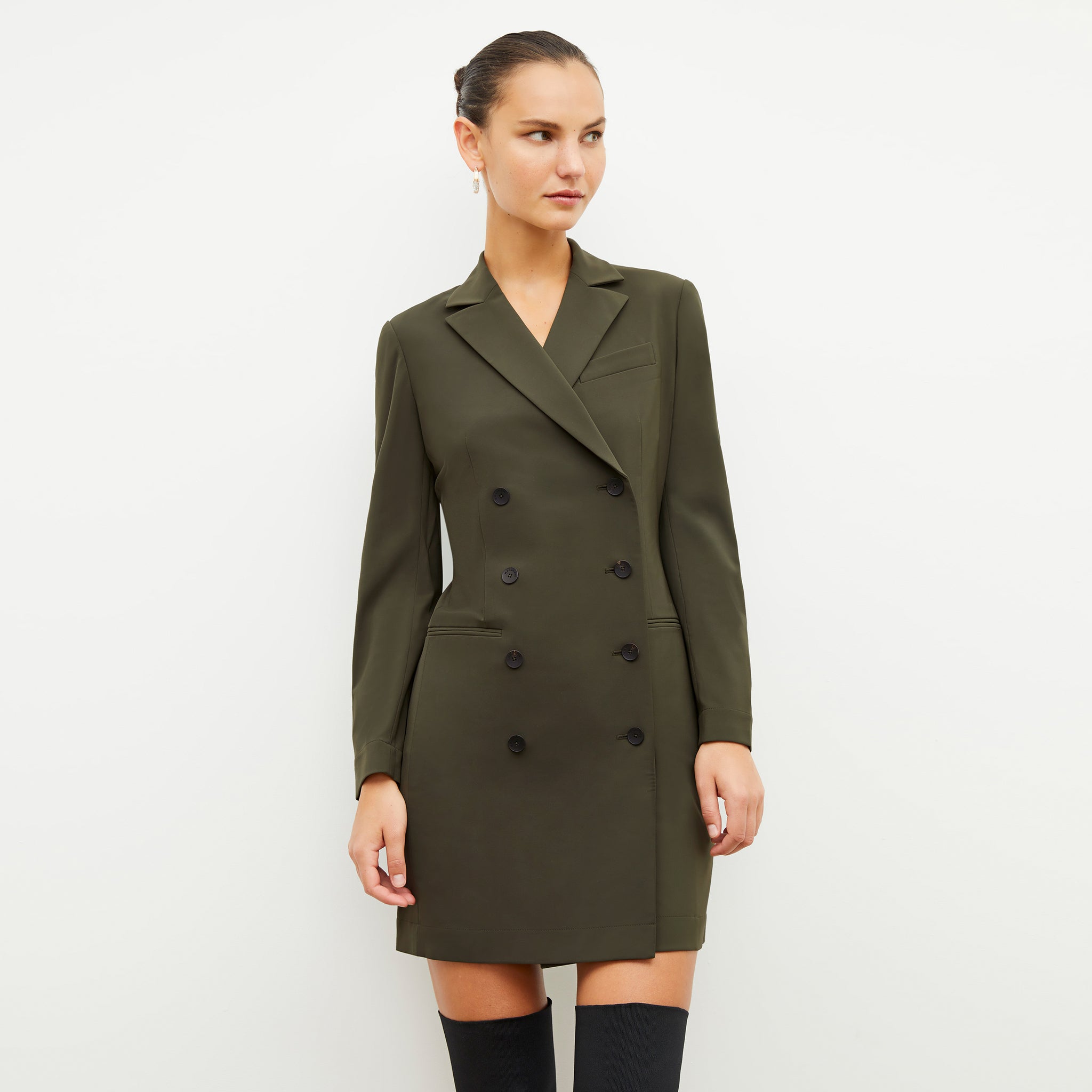 Front image of a woman wearing the gwynne dress in olive