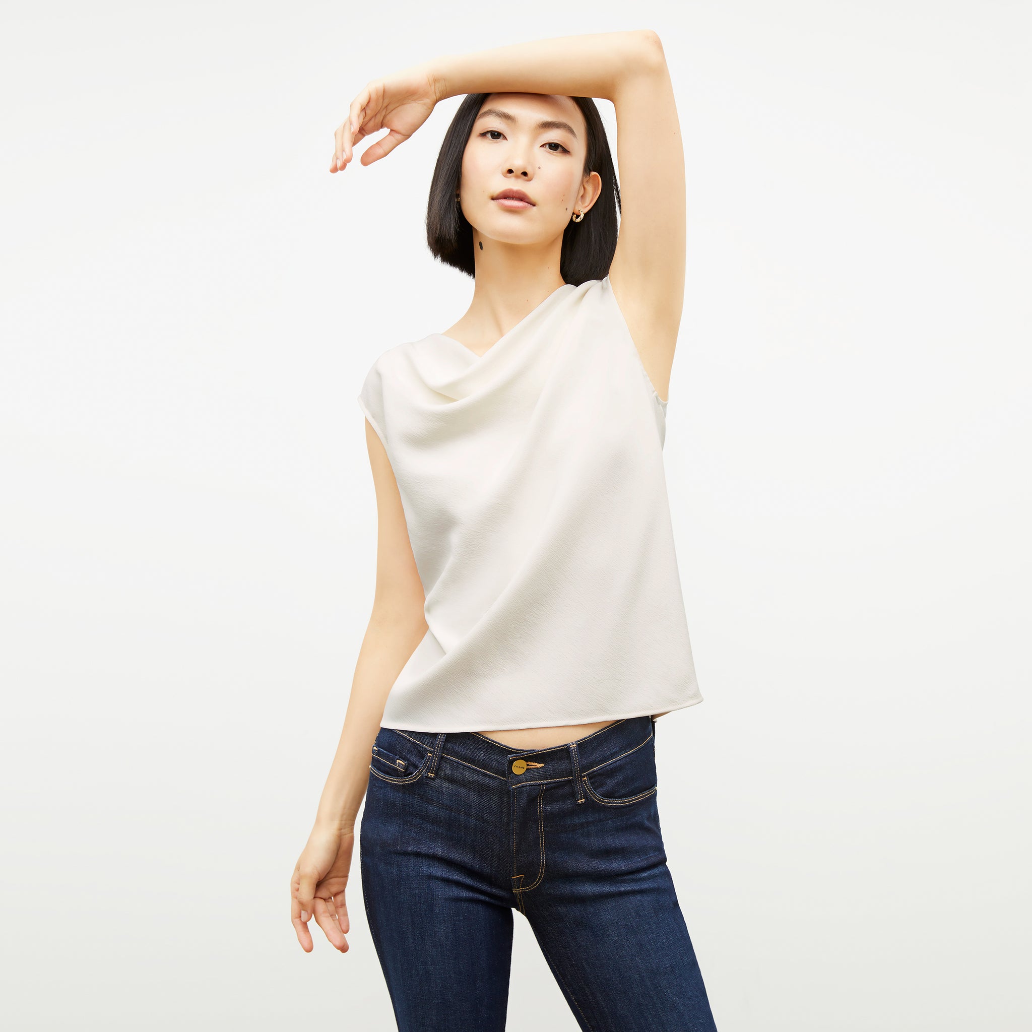 Front image of a woman wearing the Nora Top in Alabaster