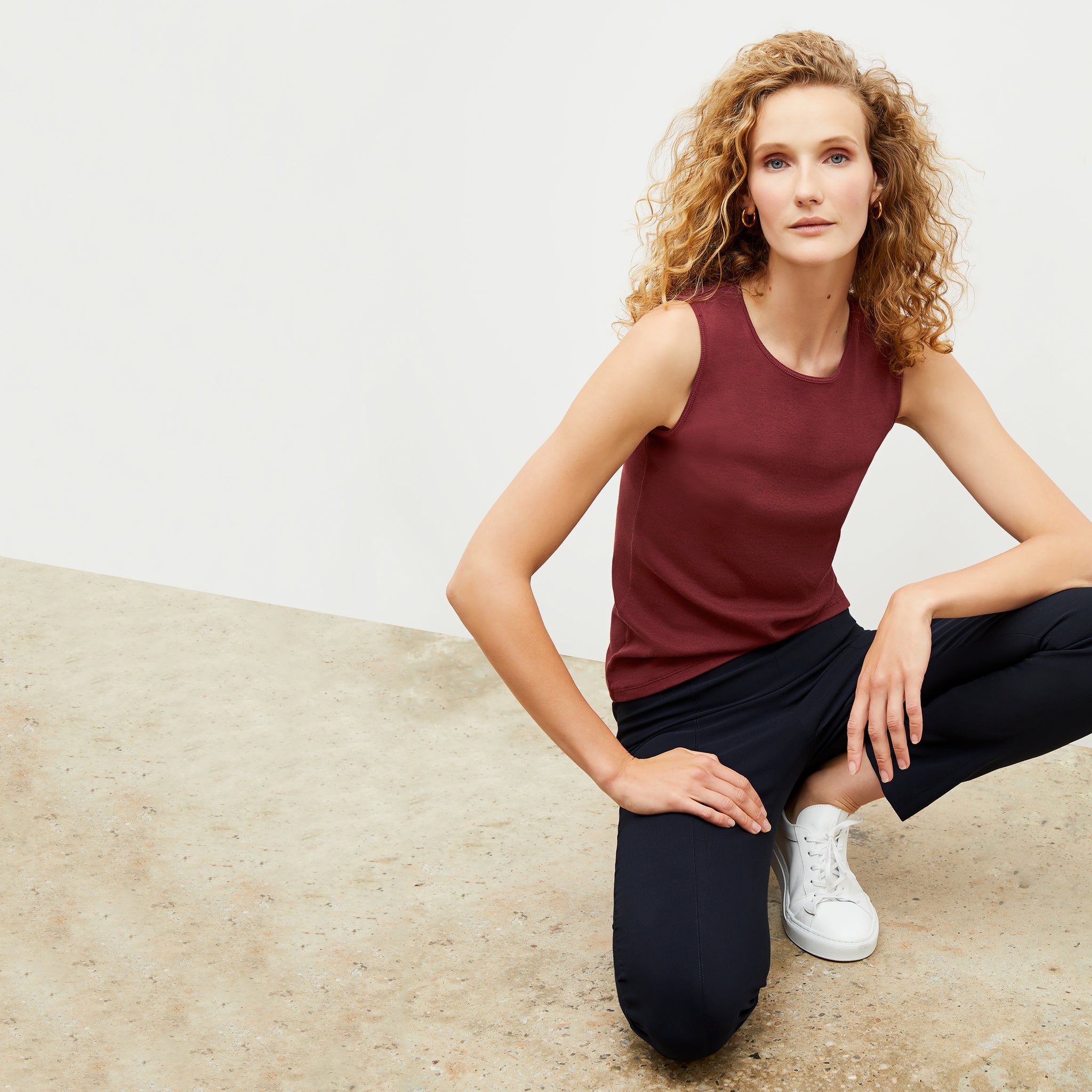 Front image of a woman wearing the Paige Top in Cranberry