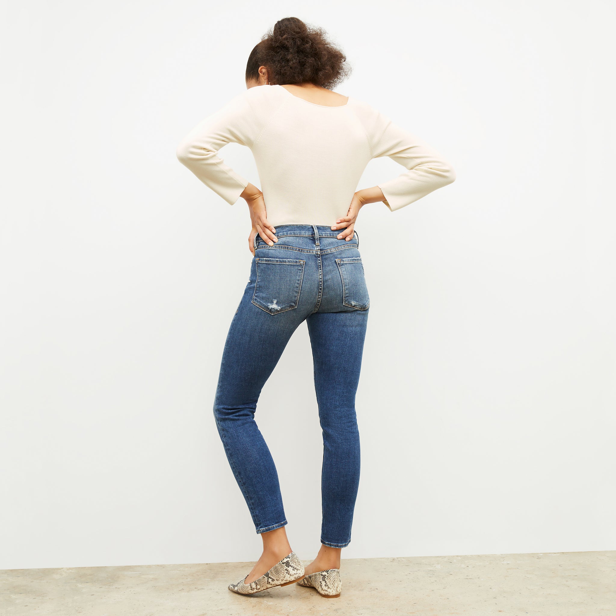 Back image of a woman wearing the FRAME Denim Le Garcon Jean in Azure