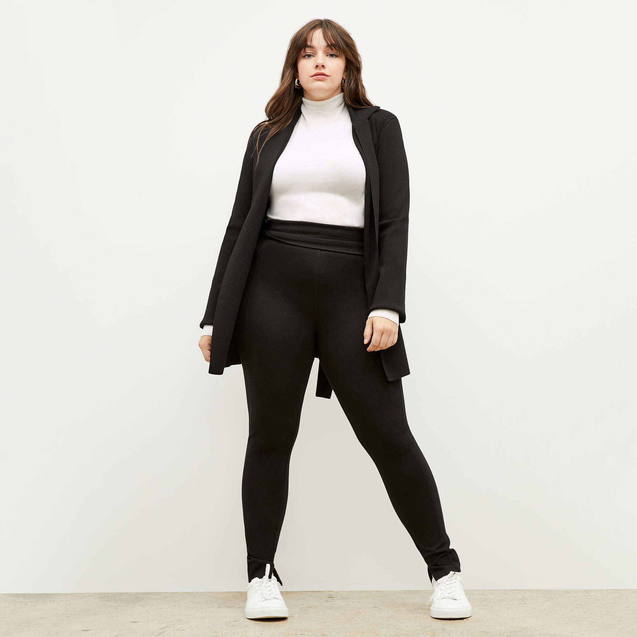 Front image of a woman standing wearing the stella legging in black