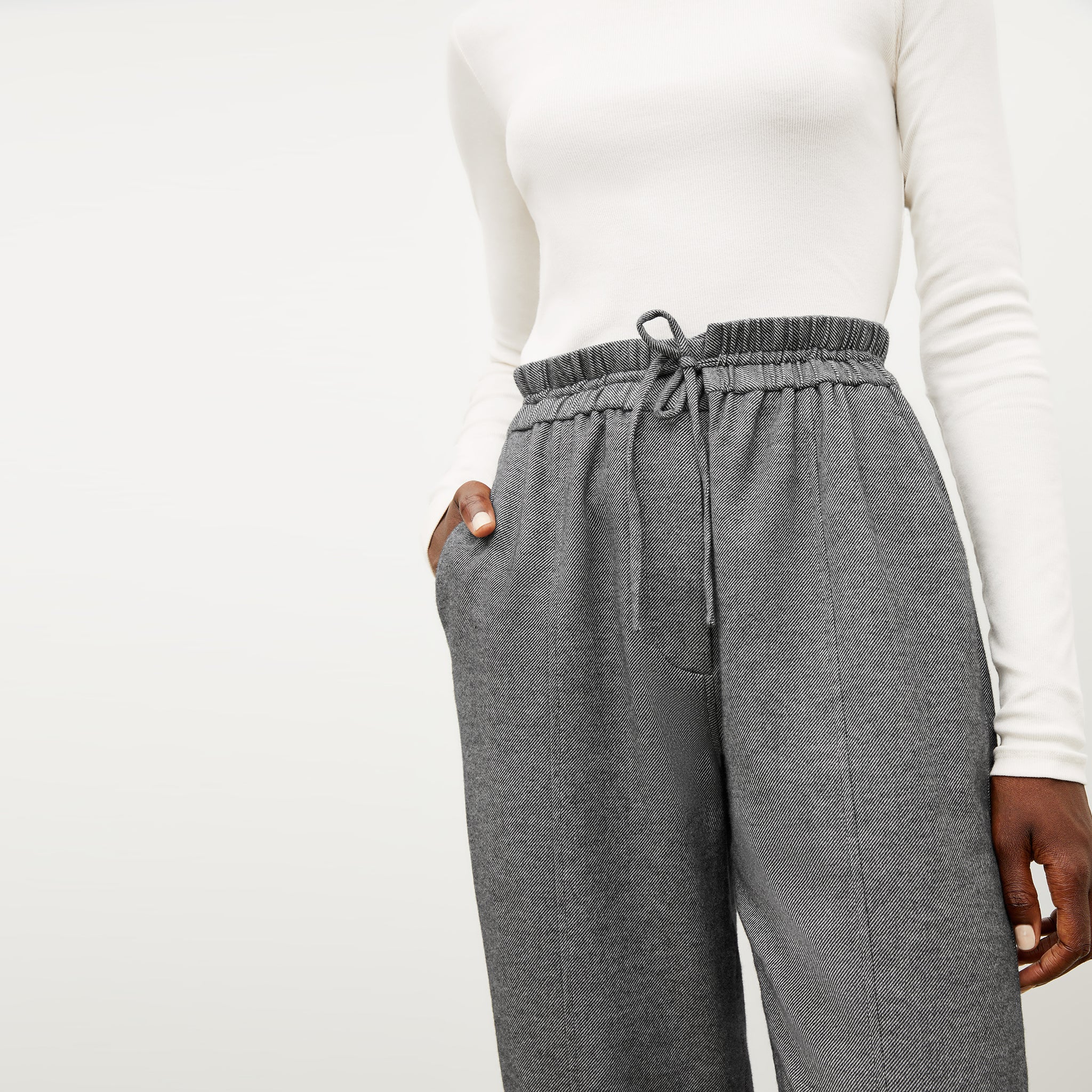 Front image of a woman wearing the shane pant in flannel twill