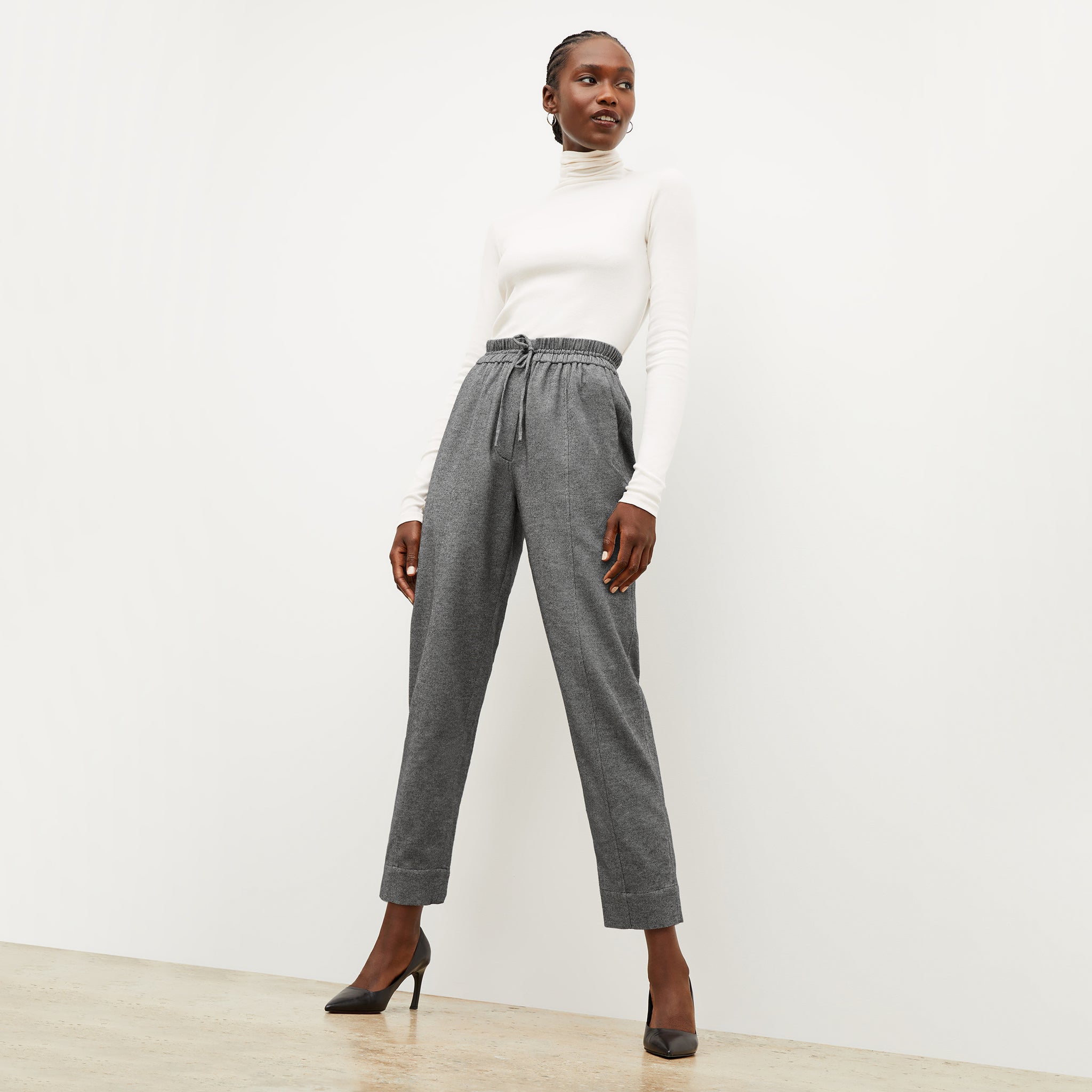 Front image of a woman wearing the shane pant in flannel twill 