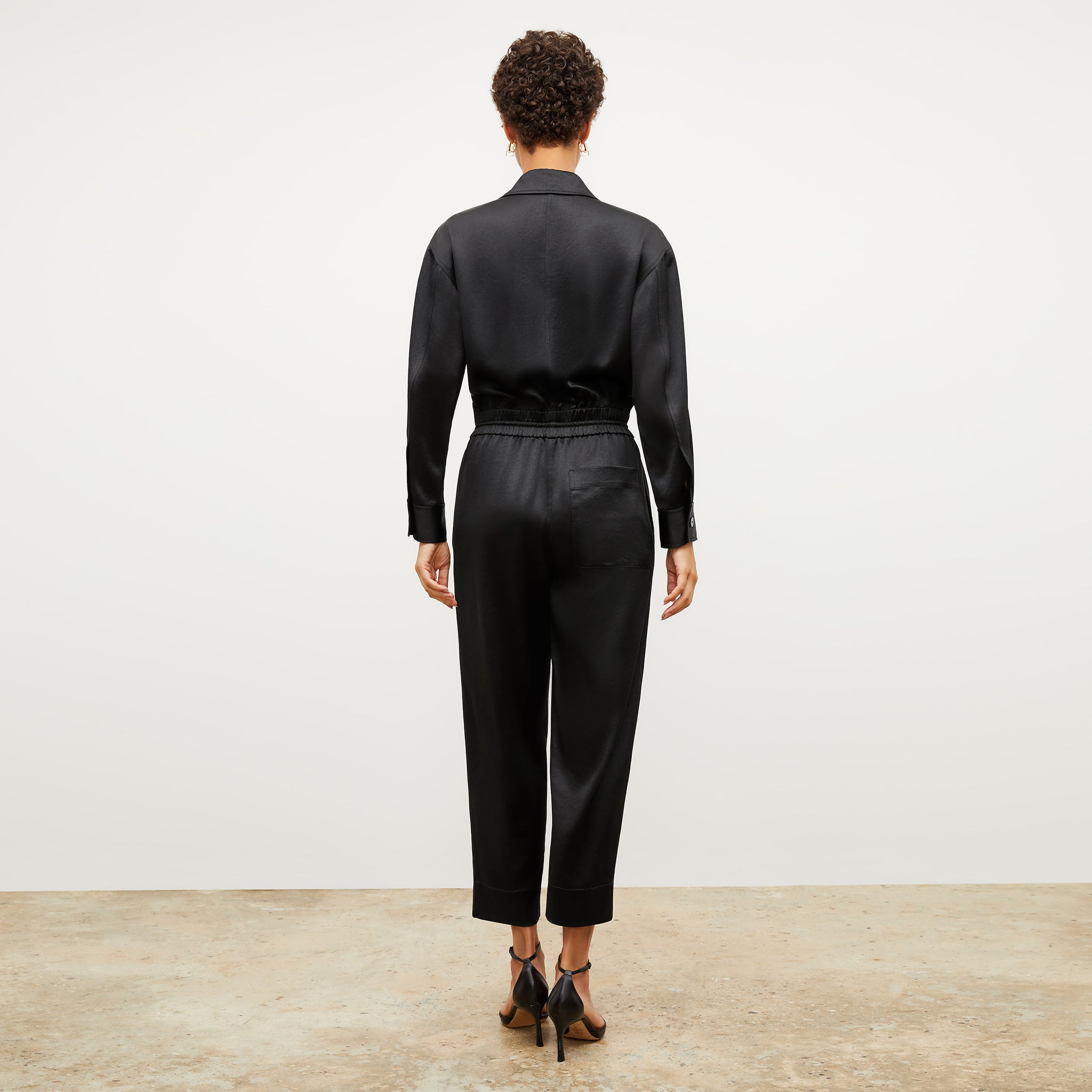 Image of a woman wearing the Carr Jumpsuit in Black