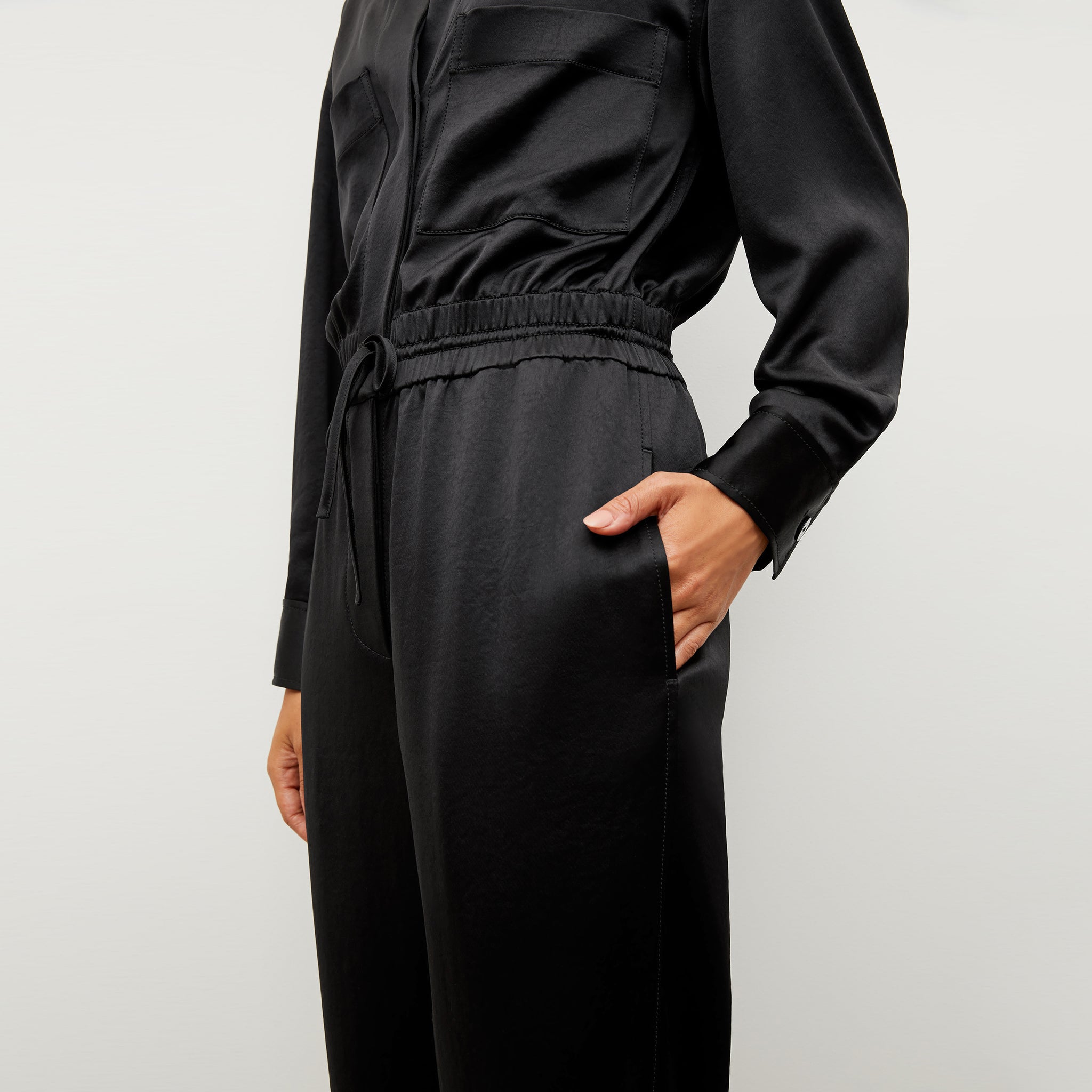 Image of a woman wearing the Carr Jumpsuit in Black
