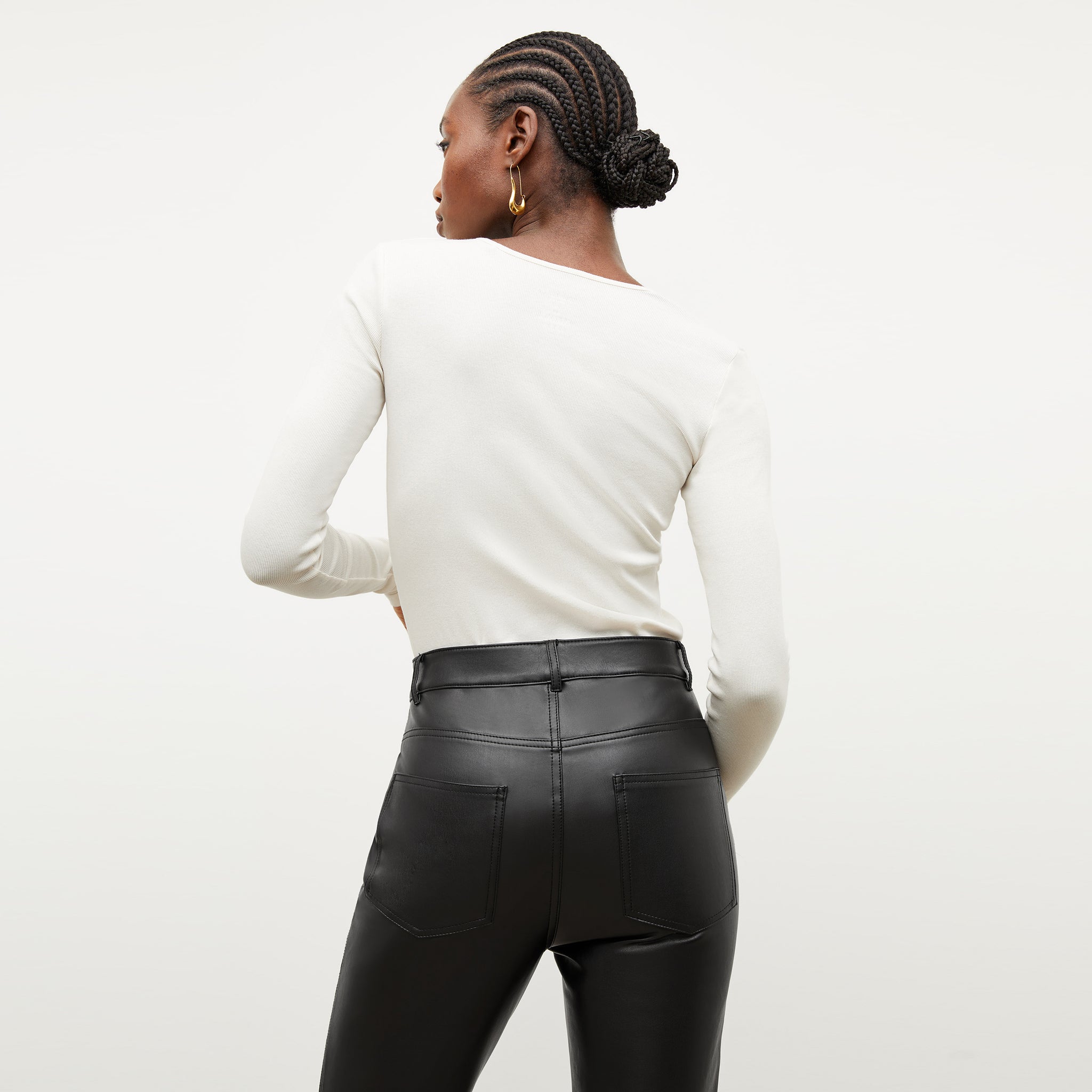 Image of a woman wearing the Remington Henley in Ivory