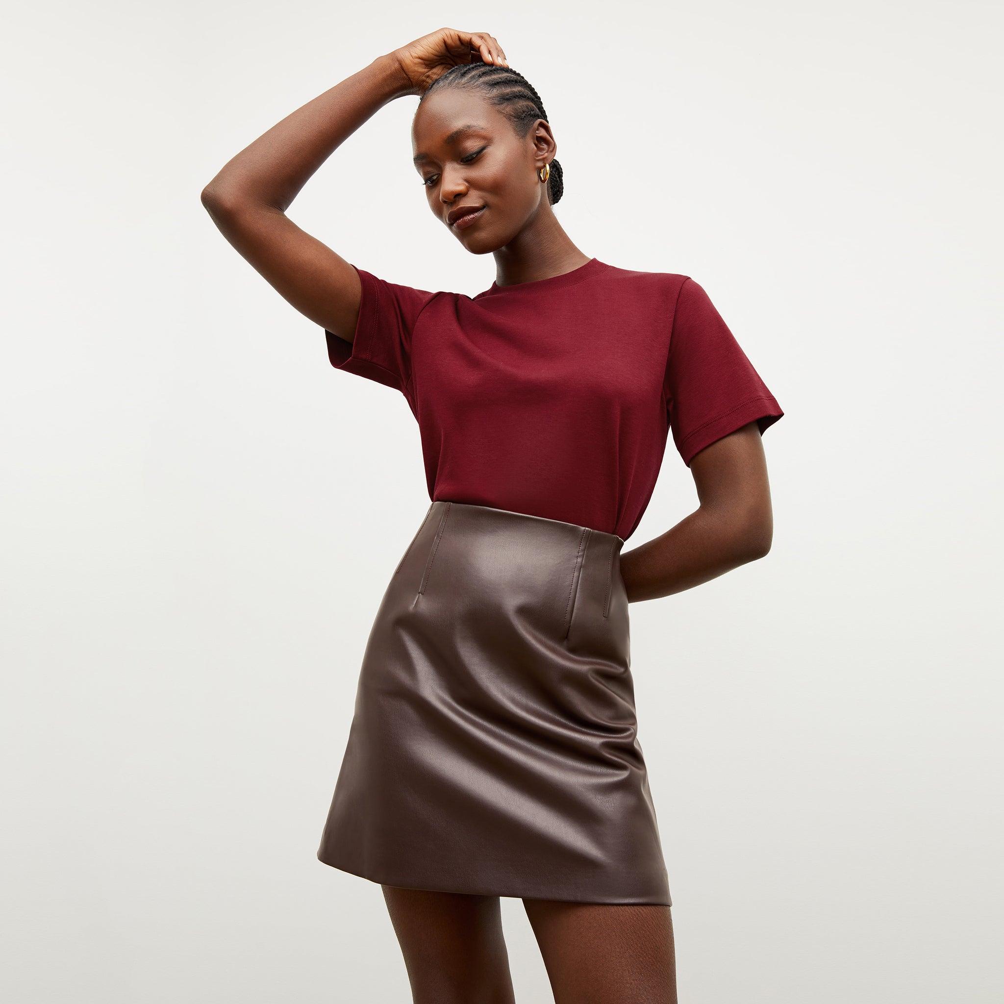 Front image of a woman wearing the Whitney Skirt in Brown