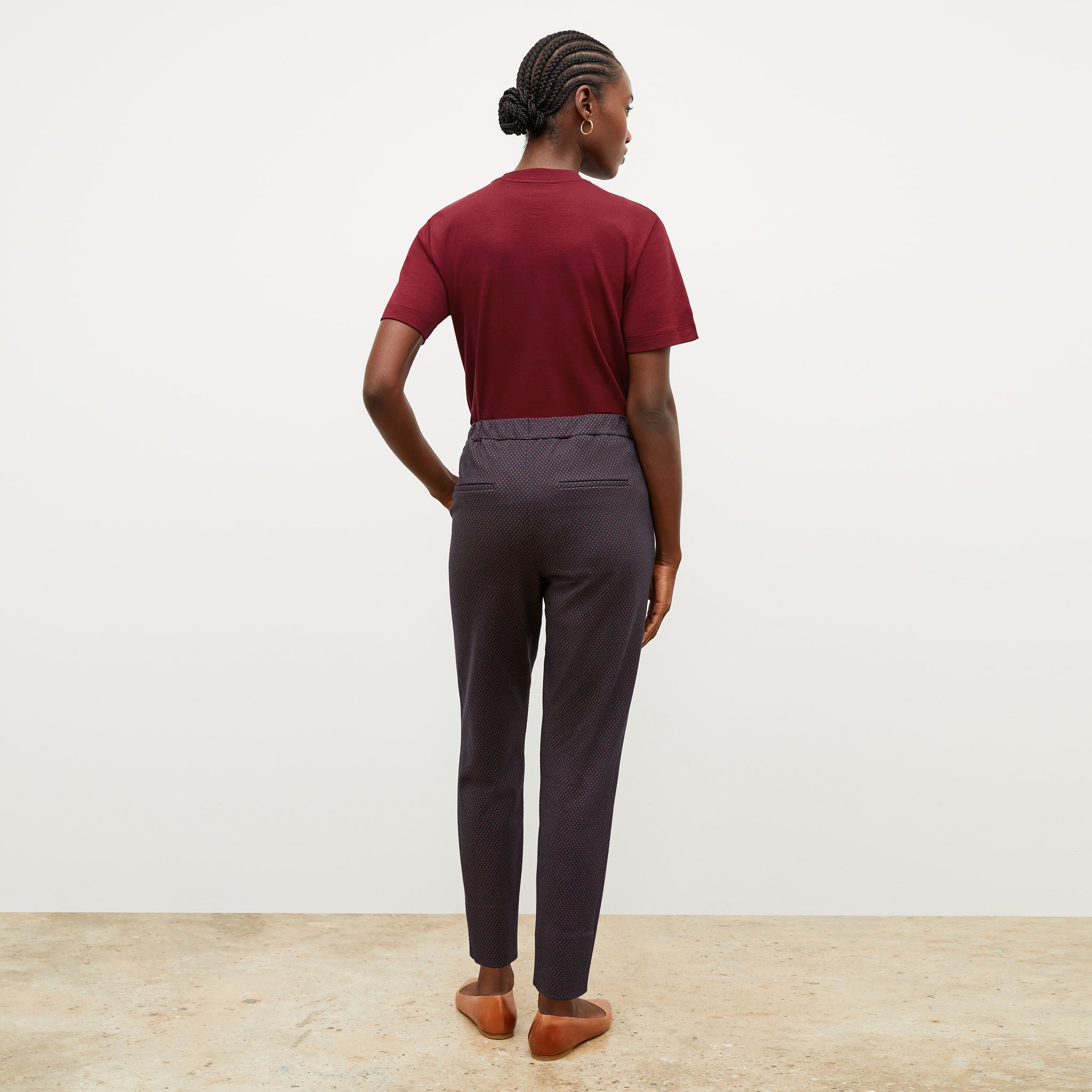 Back image of a woman wearing the leslie tshirt in maroon