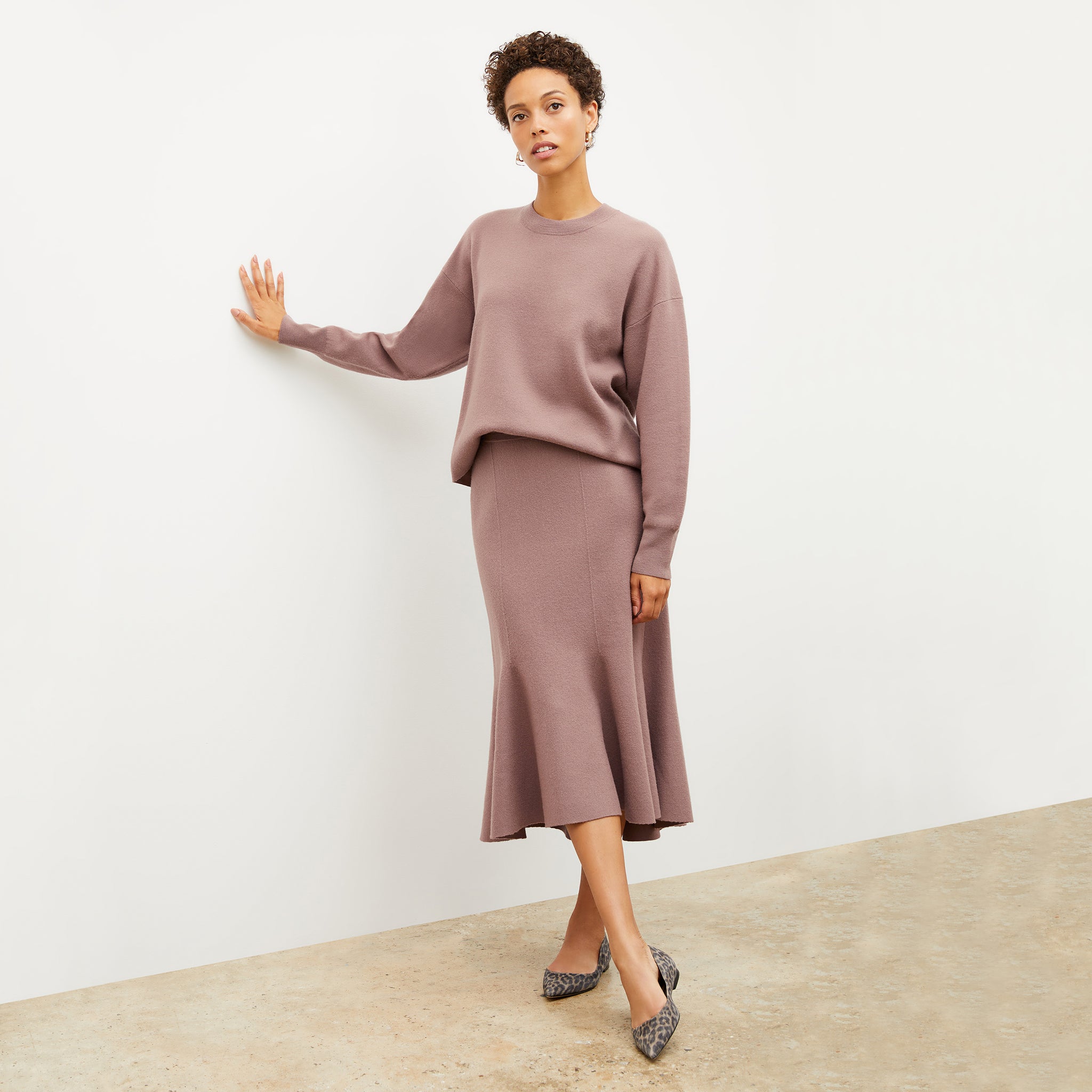 Front image of a woman wearing the quincy sweater in rose taupe