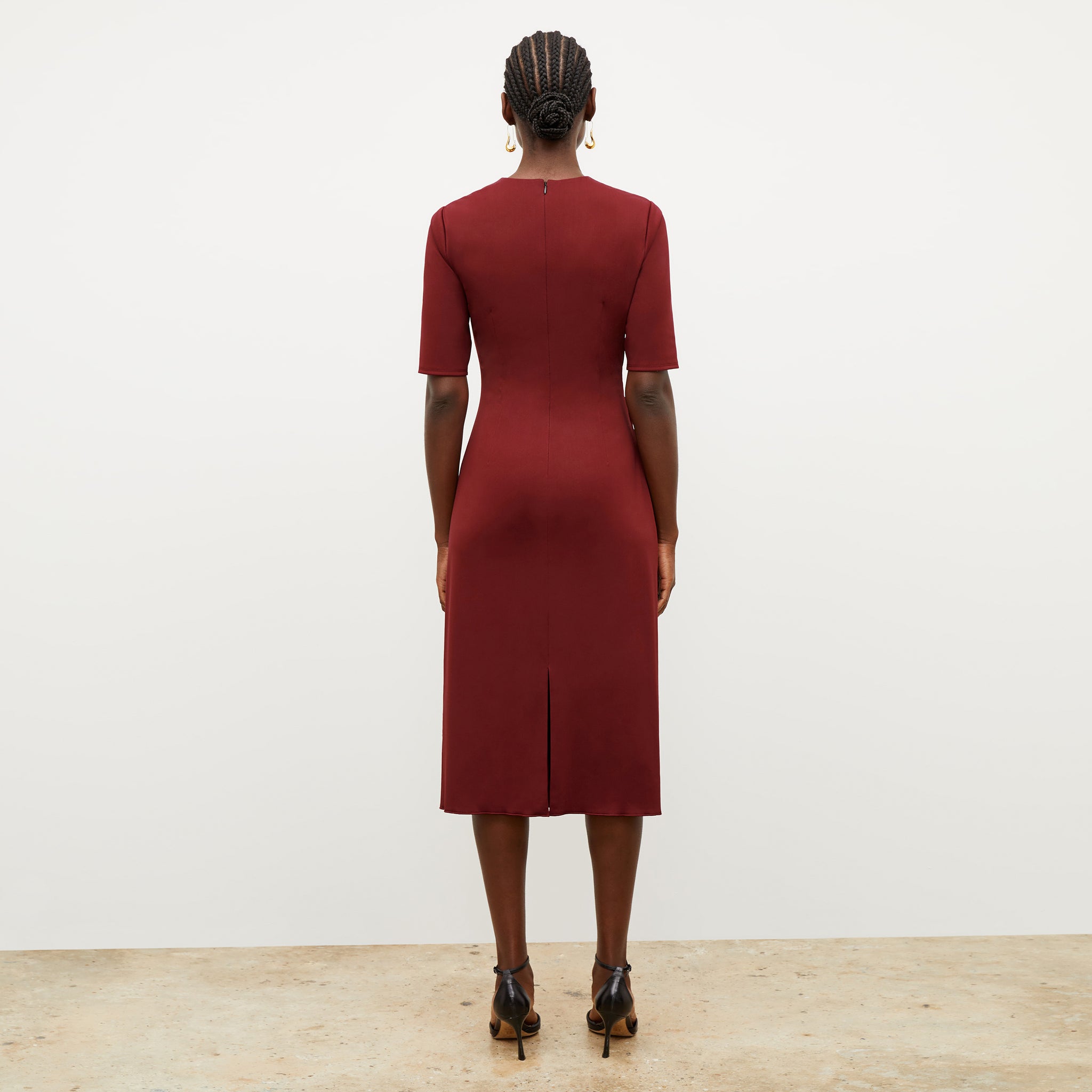 Image of a woman wearing the Ciela Dress in Maroon