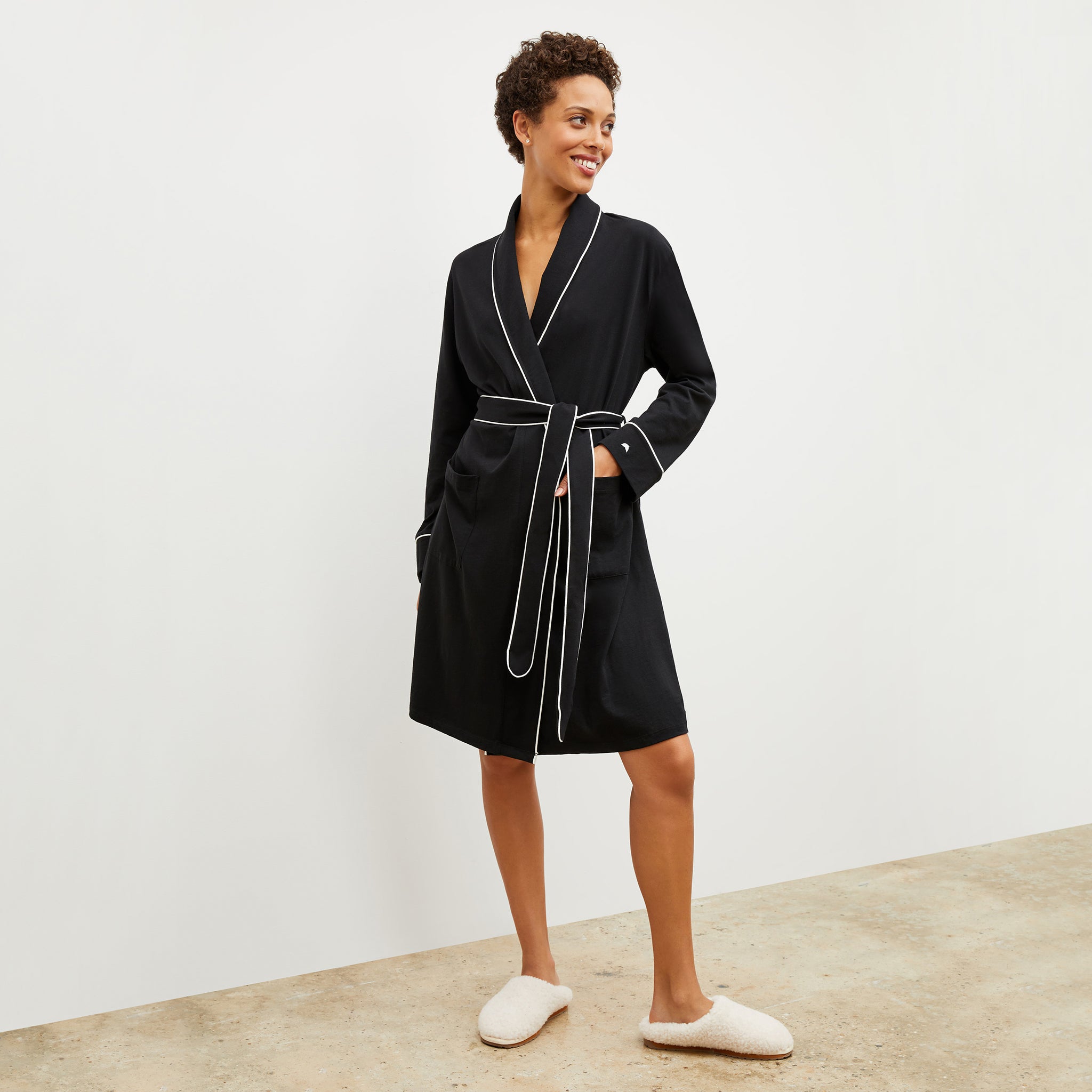 Front image of a woman wearing the Petite Plume x M.M. Luxe Pima Robe in Black