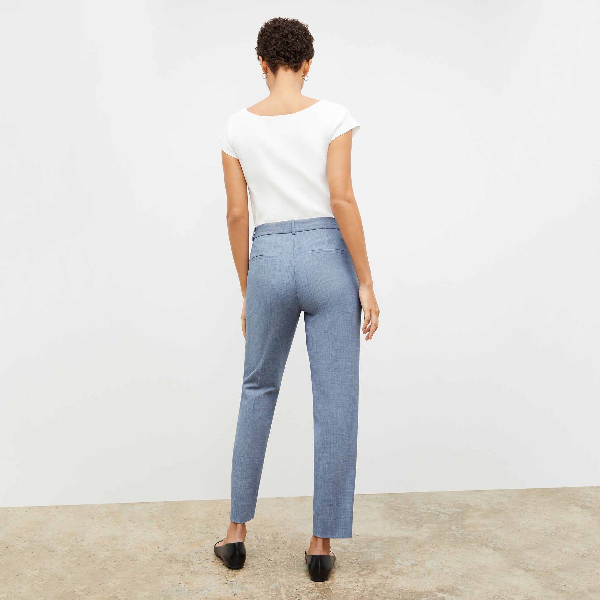 Back image of a woman wearing the mejia pant in indigo and white
