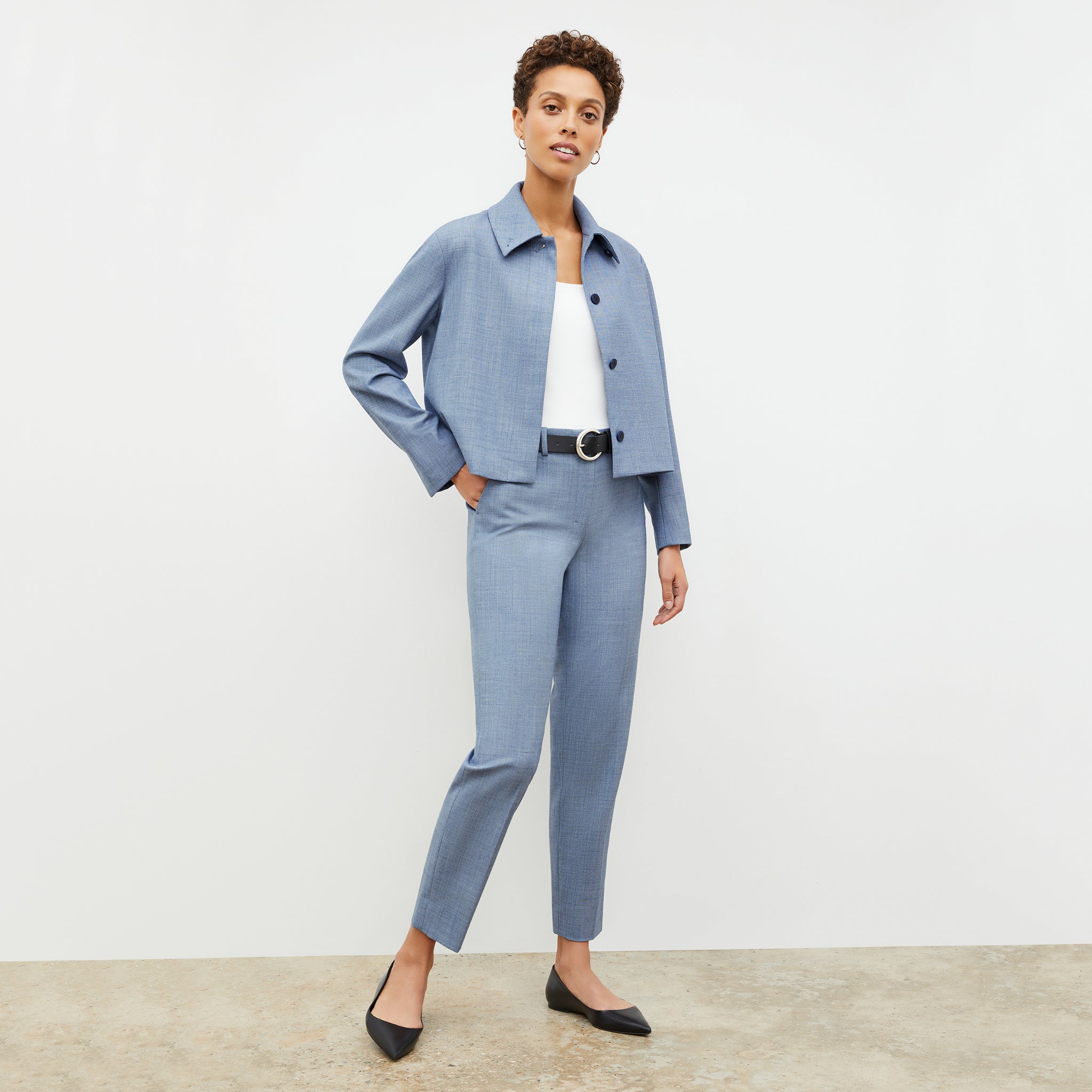 Front image of a woman wearing the mejia pant in indigo and white
