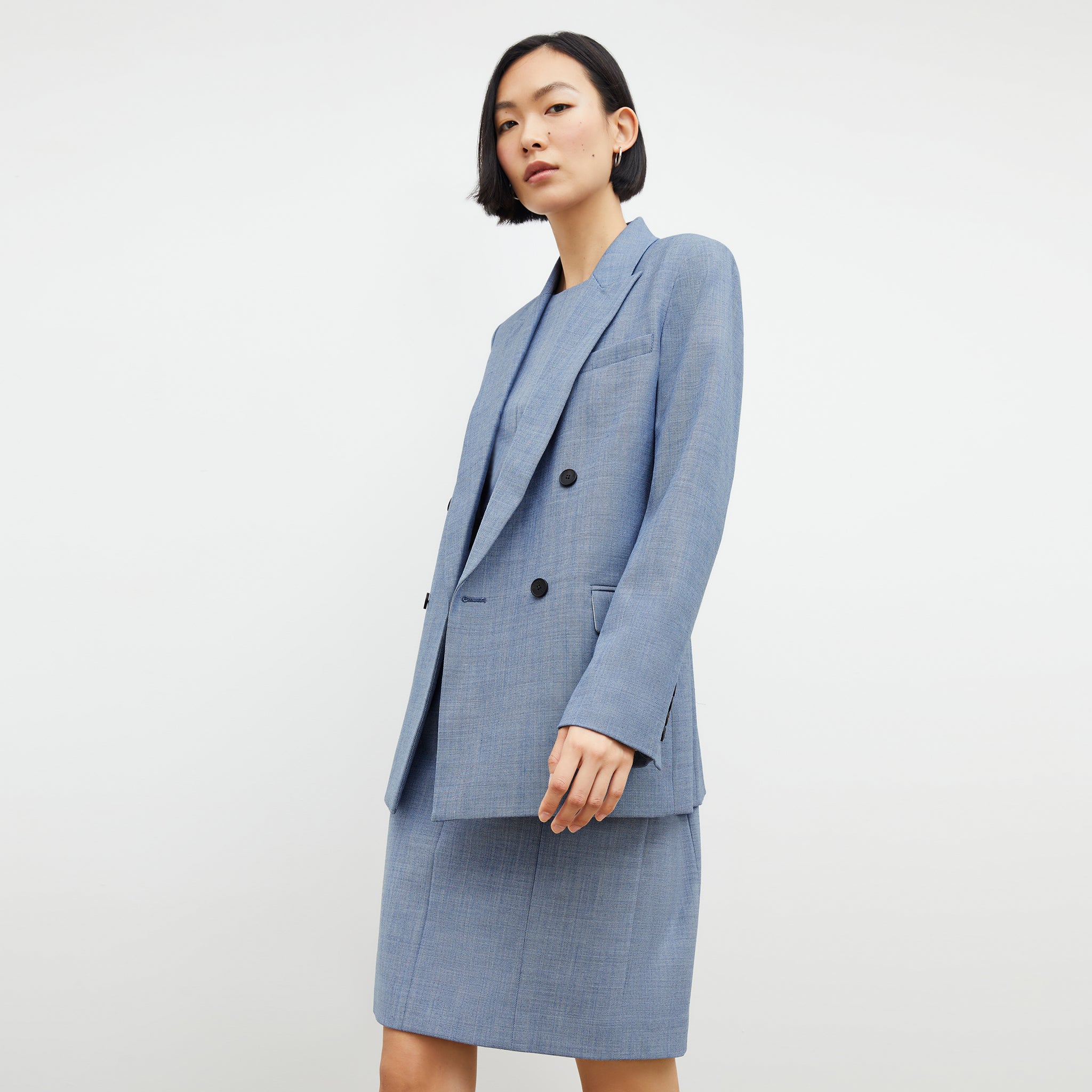 Front image of a woman wearing the constance dress in indigo and white