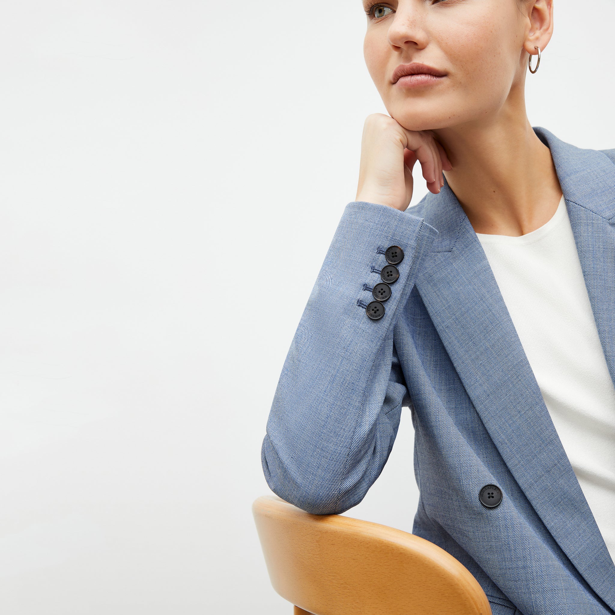 Front image of a woman wearing the ohara blazer in indigo and white