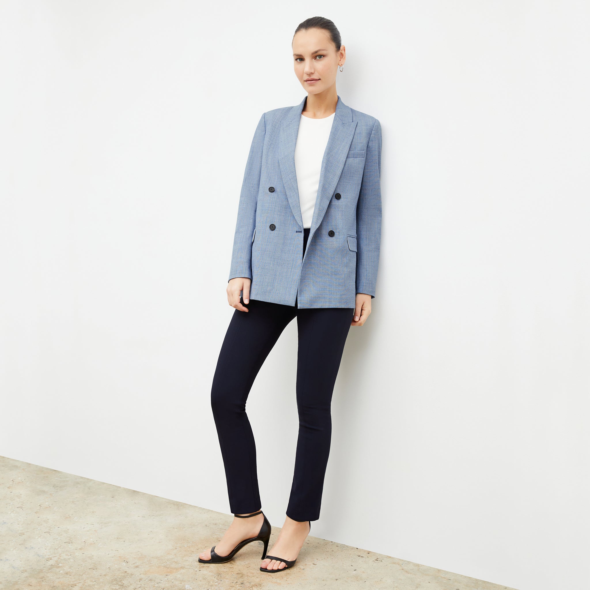 Front image of a woman wearing the ohara blazer in indigo and white 