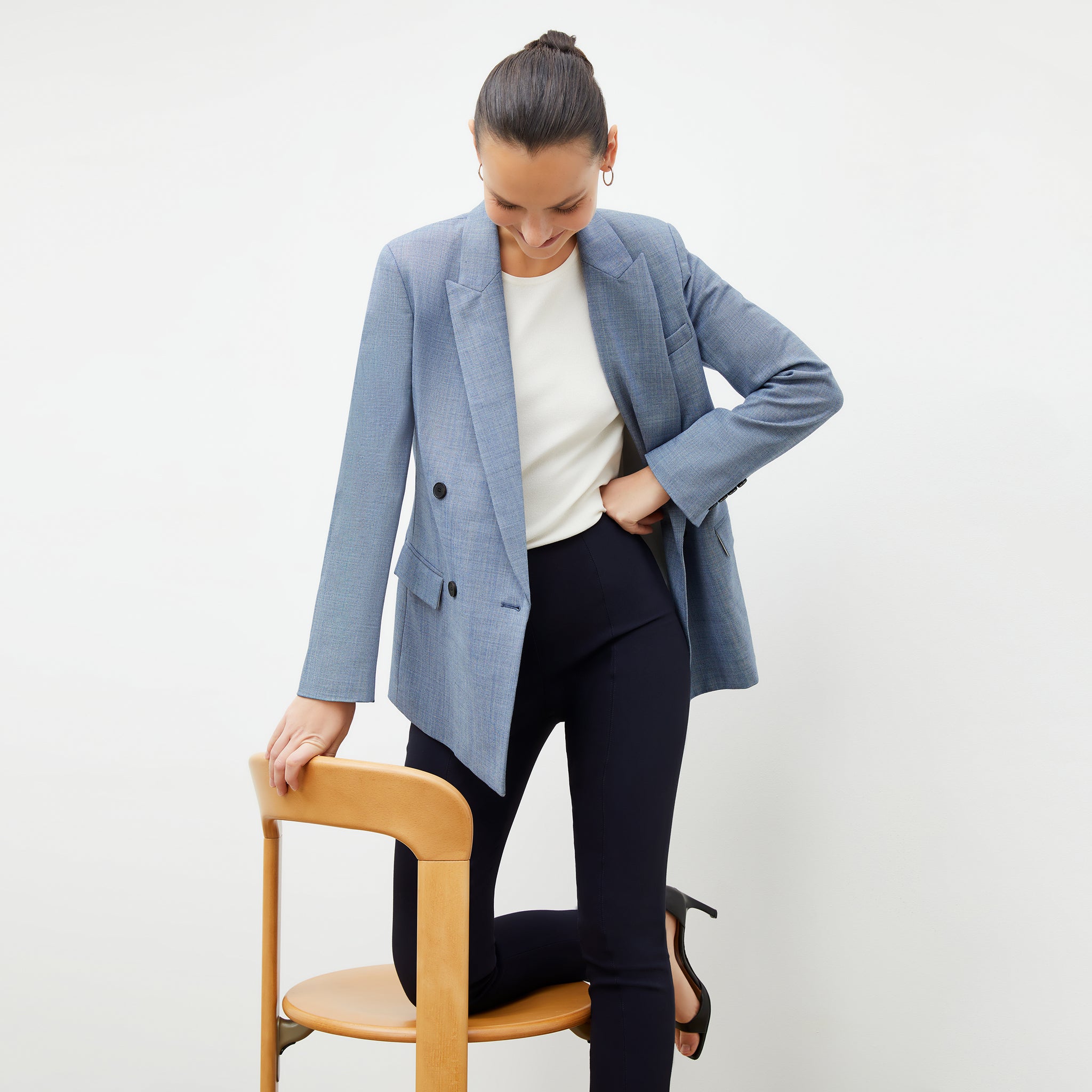 Front image of a woman wearing the ohara blazer in indigo and white