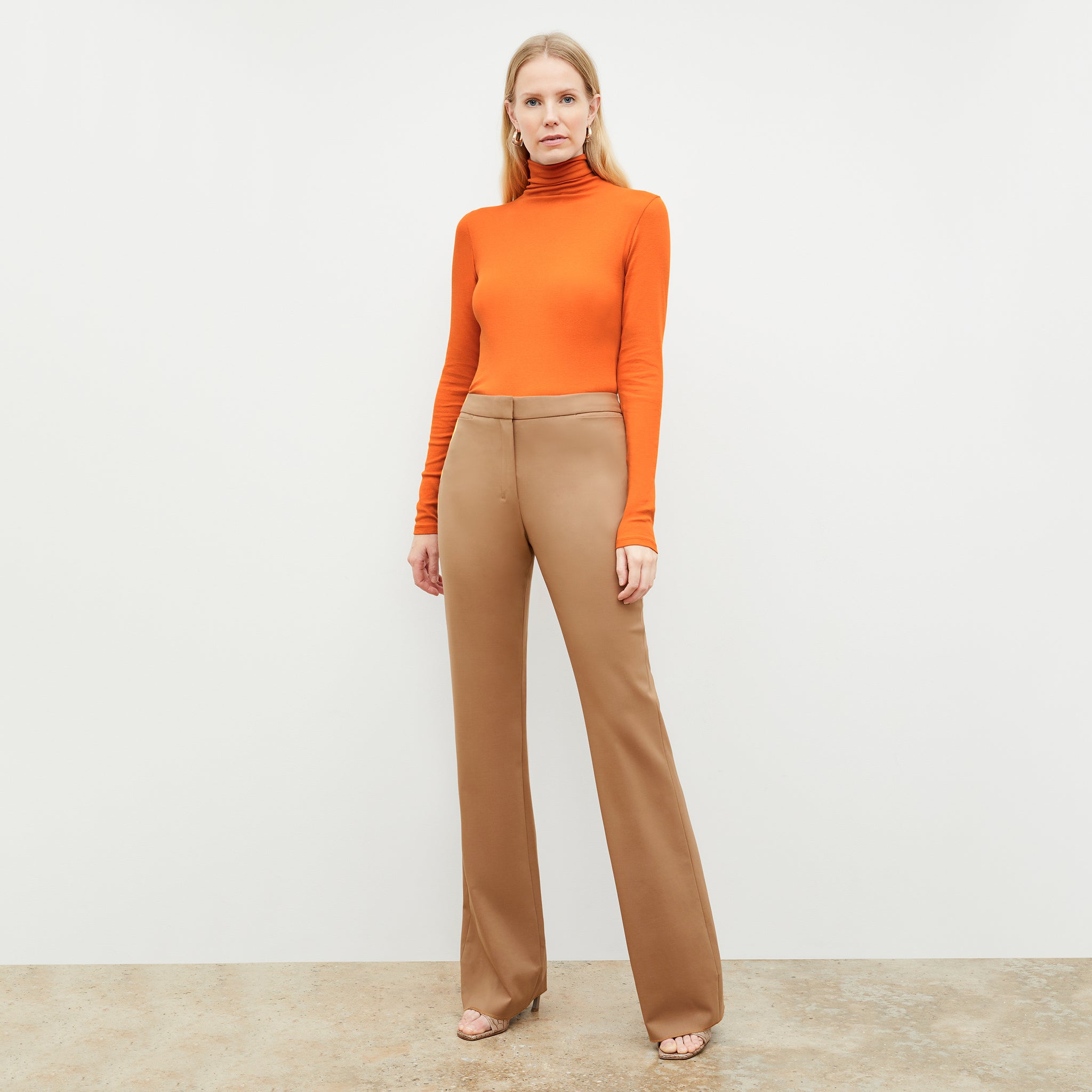 Front image of a woman standing wearing the Horton Pant-Washable Wool Twill in camel