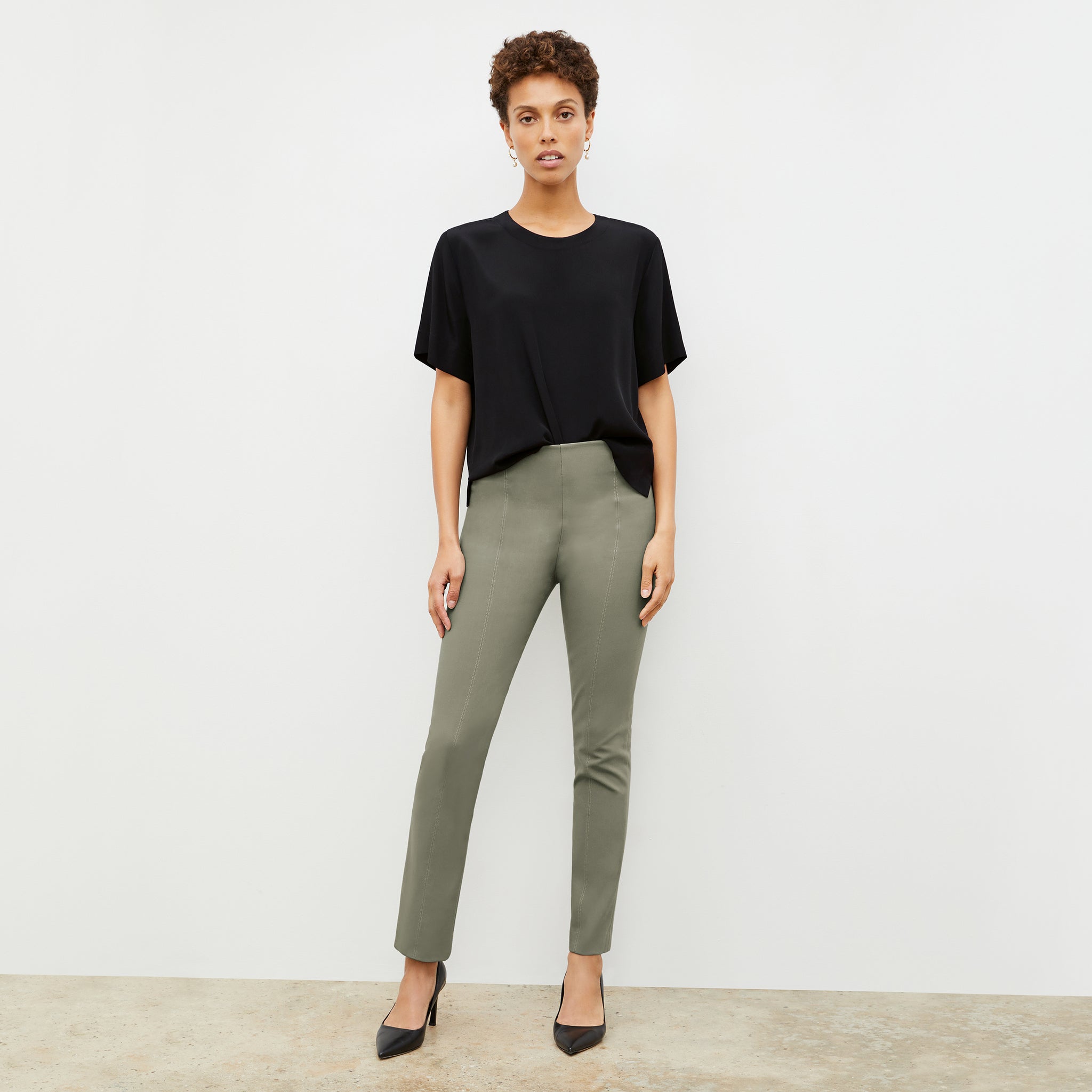 Front image of a woman wearing the foster pant in thyme 