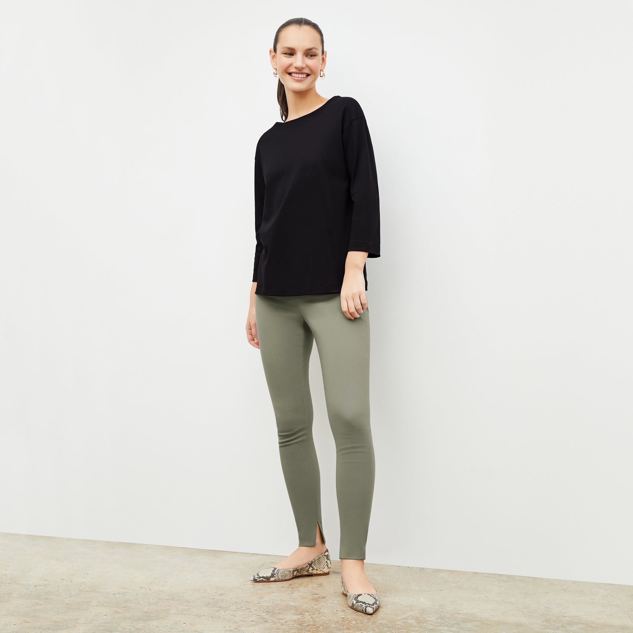 Front image of a woman wearing the skinny foster in thyme