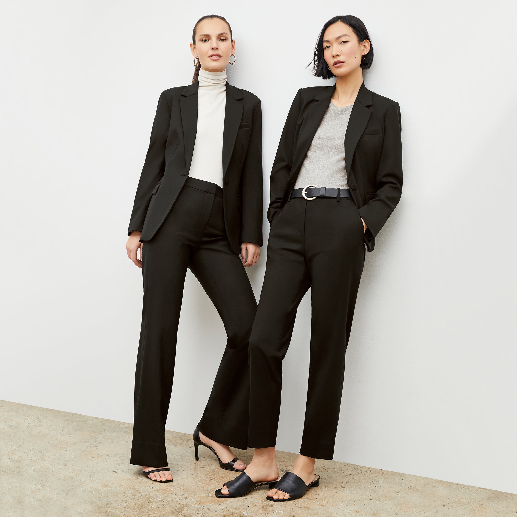 Front image of a woman wearing the Yiyan Blazer Short in Black and a woman wearing the Yiyan Blazer in Black