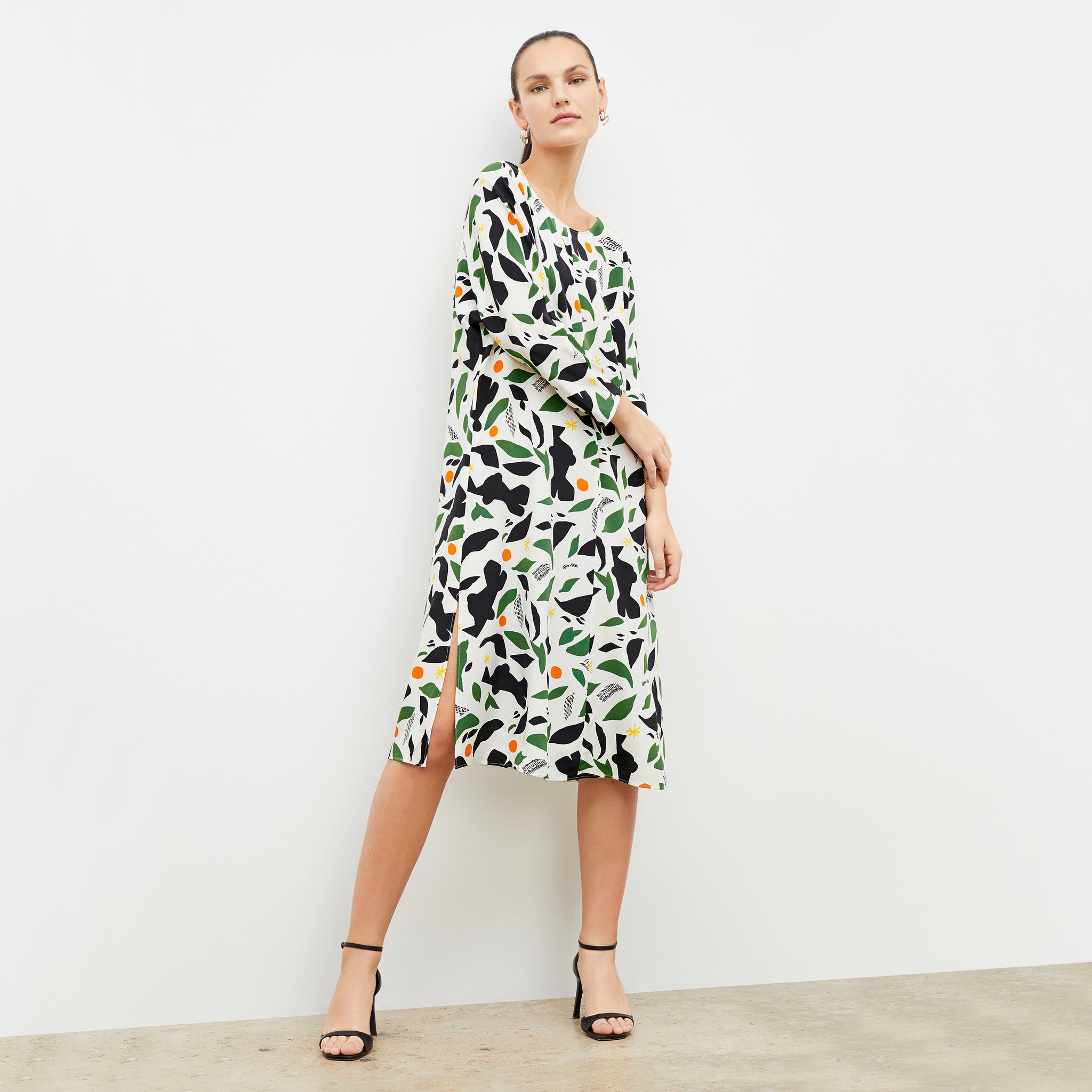 Front image of woman wearing the alesia dress in icon print 