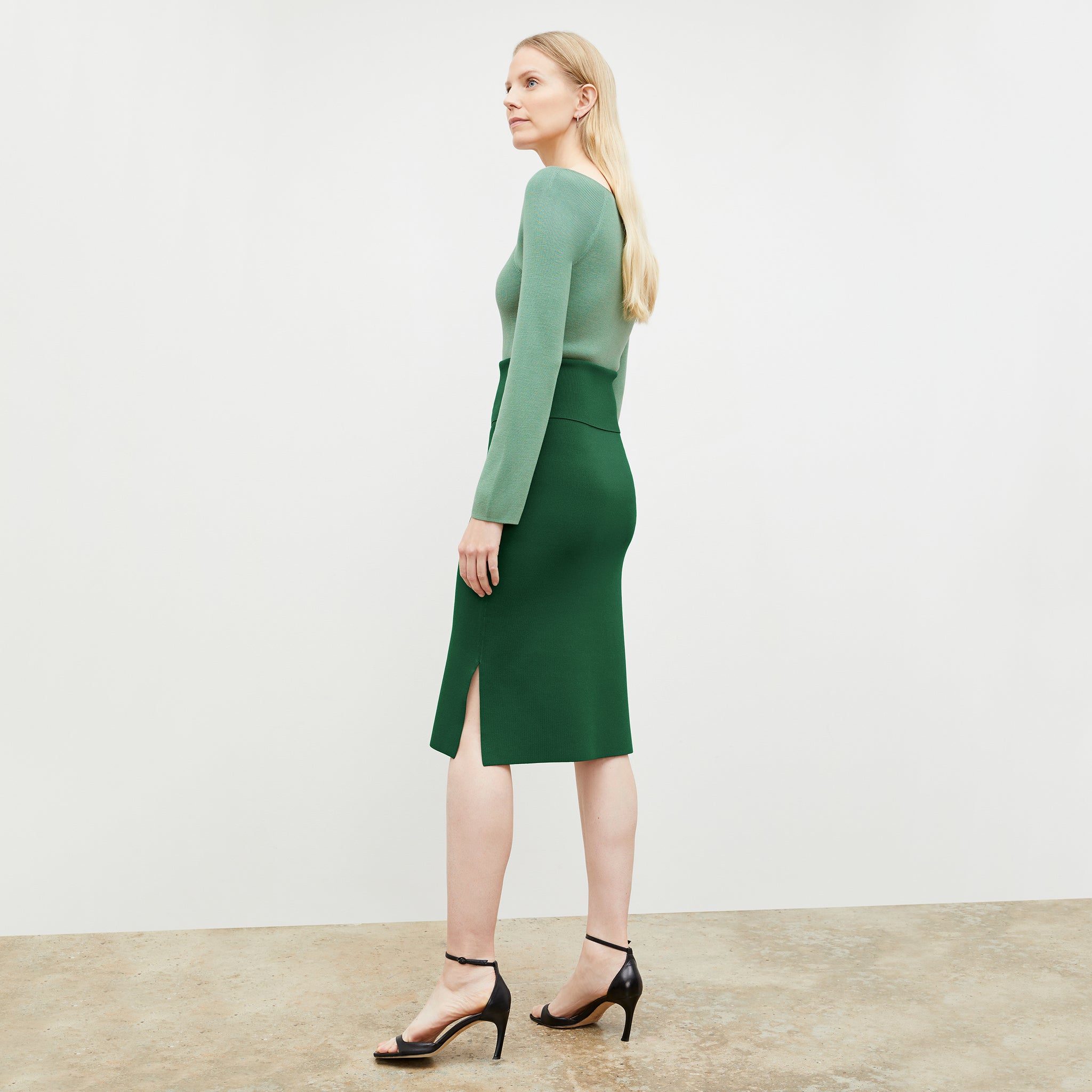 Side image of a woman wearing the joya top in spring green