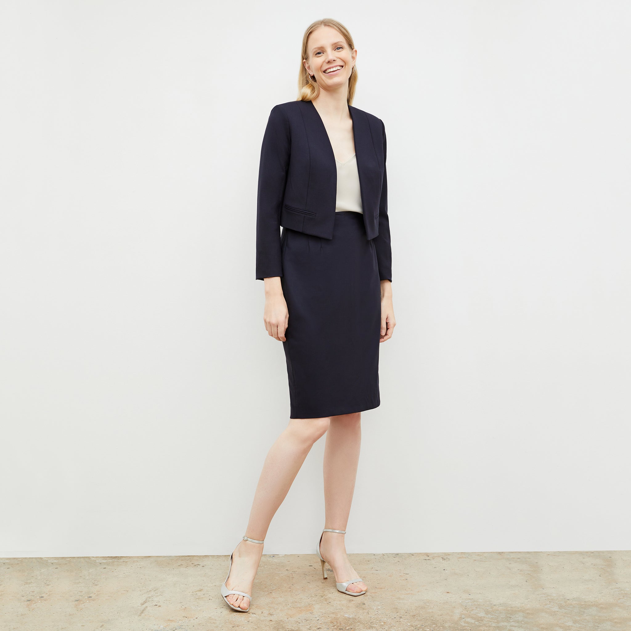 Front image of a woman wearing the Cobble hill skirt in galaxy blue
