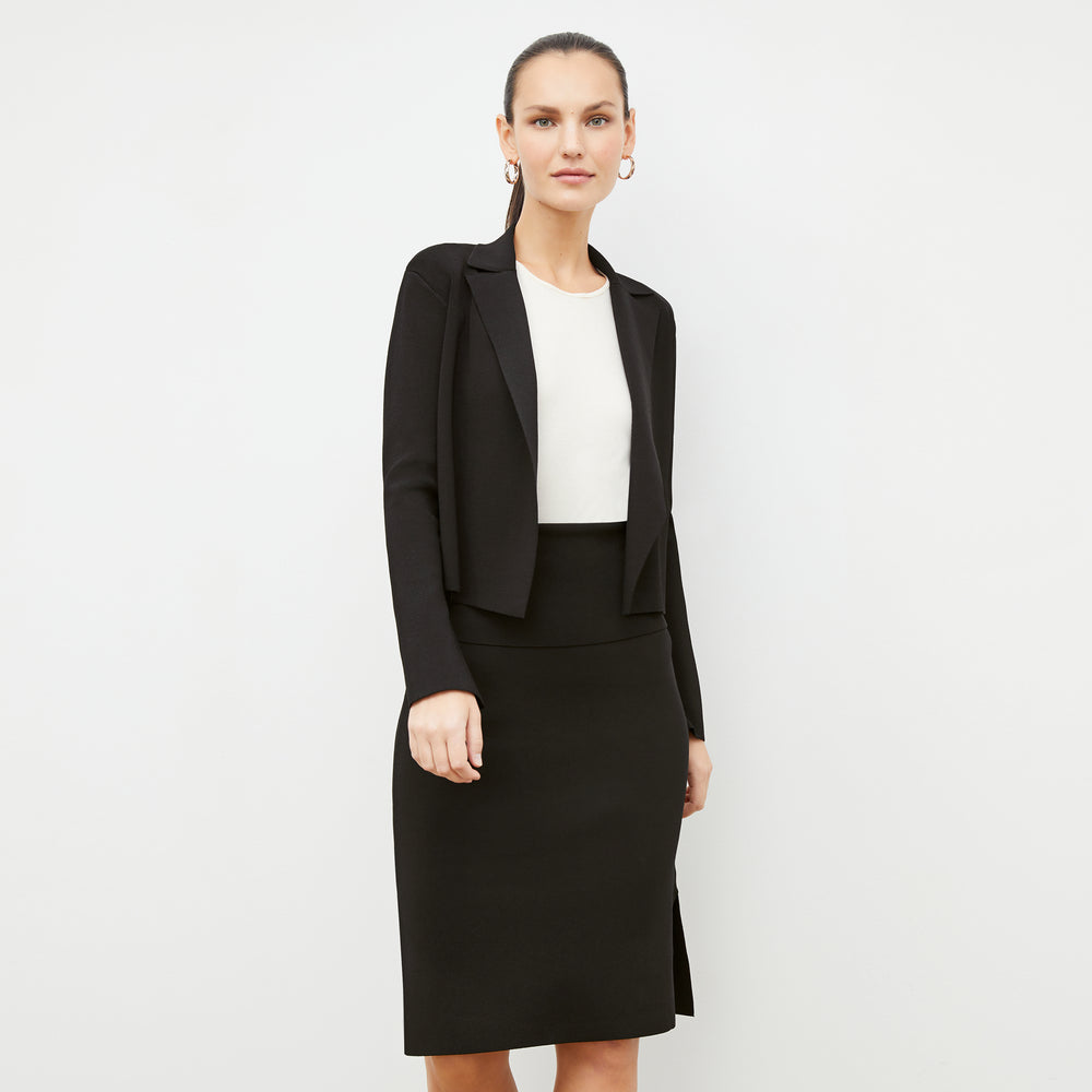 Front image of a woman standing wearing the Jolie Jardigan in Black