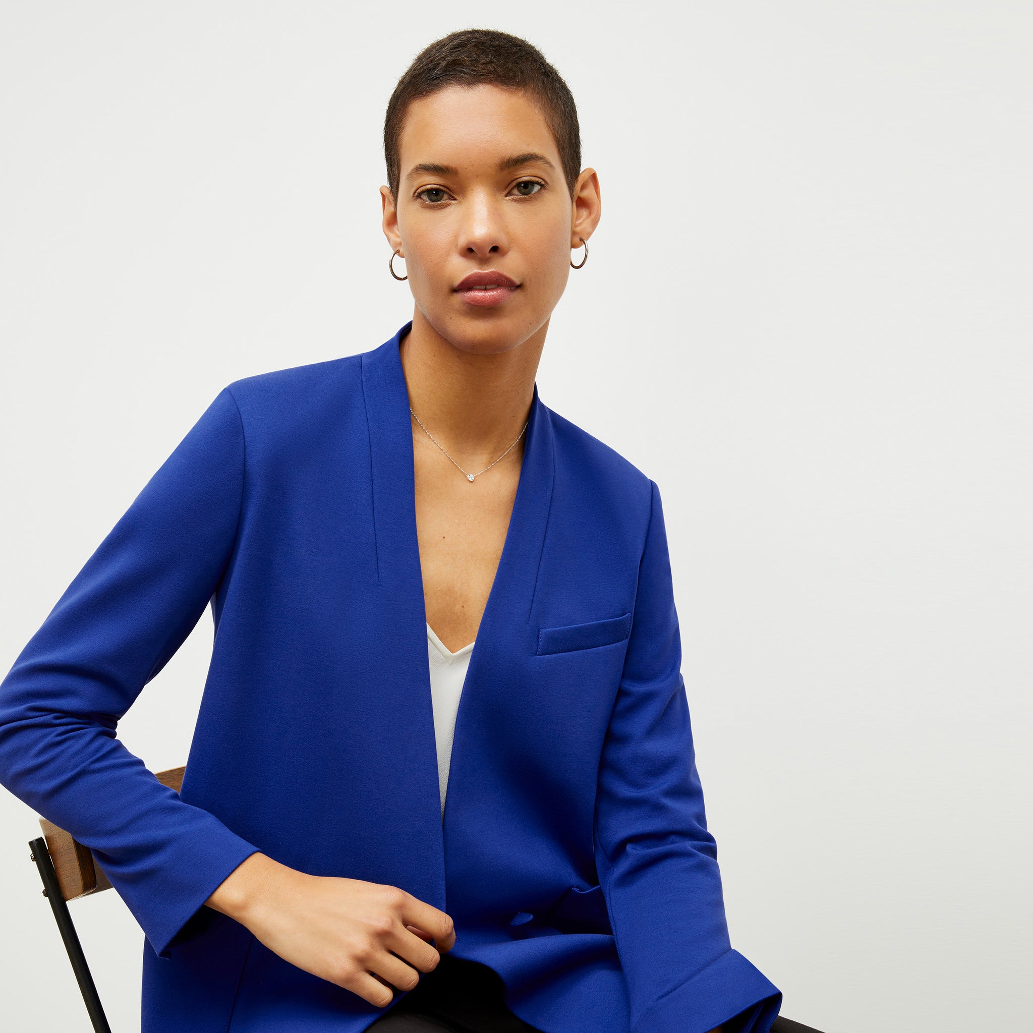 image of a woman wearing the janette jacket in electric blue