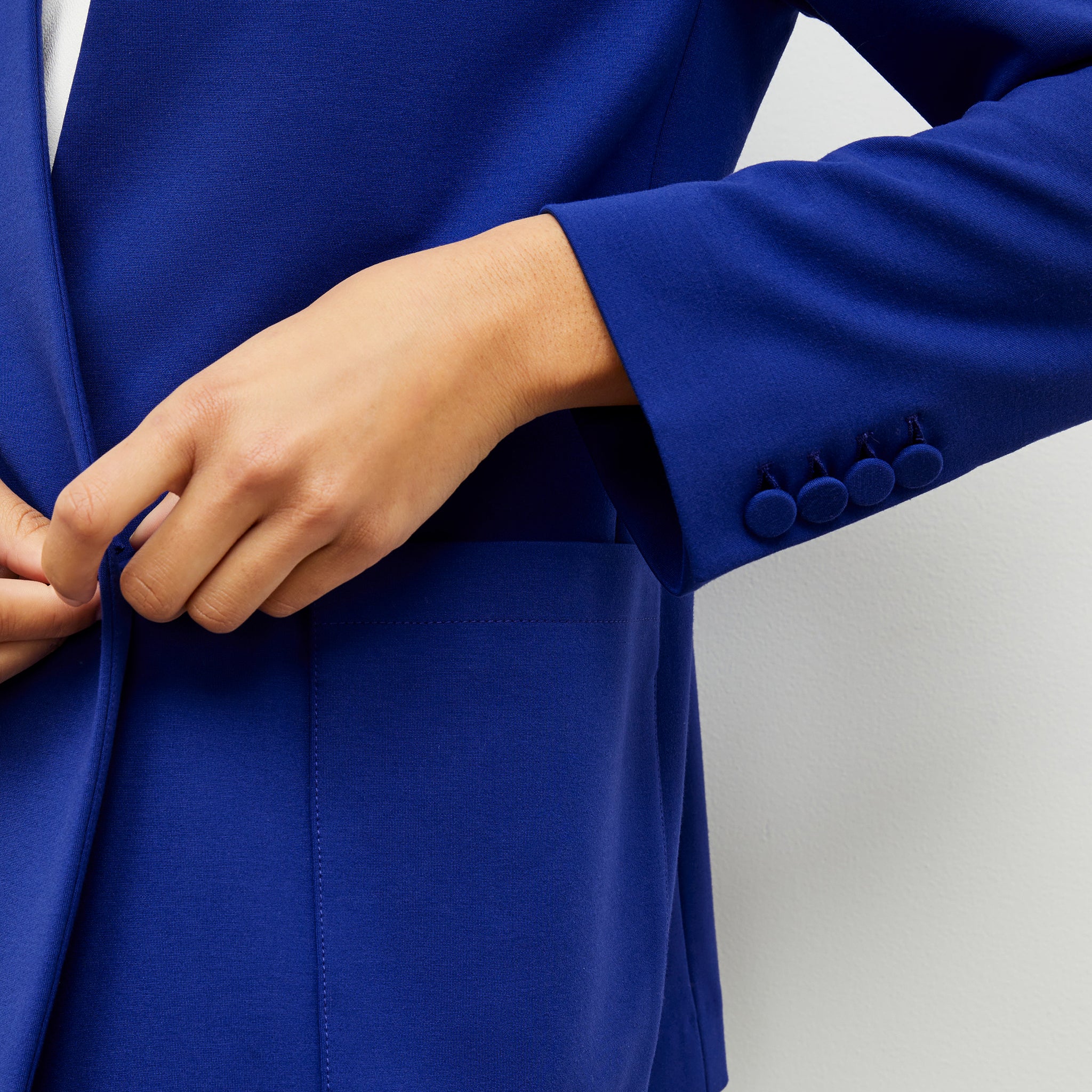 detailed sleeve image of a woman wearing the janette jacket in electric blue