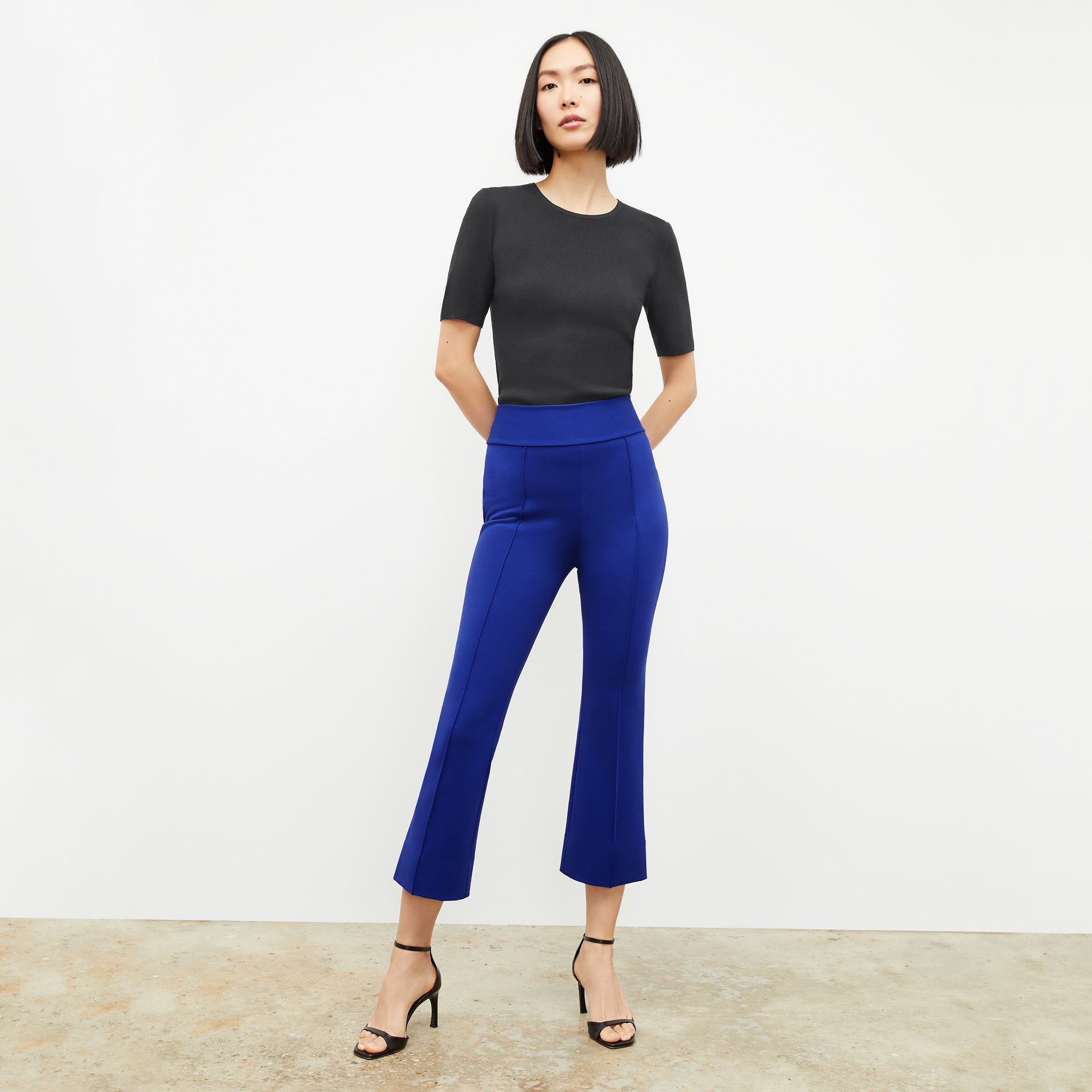 front image of a woman wearing the allyn pants in electric blue 
