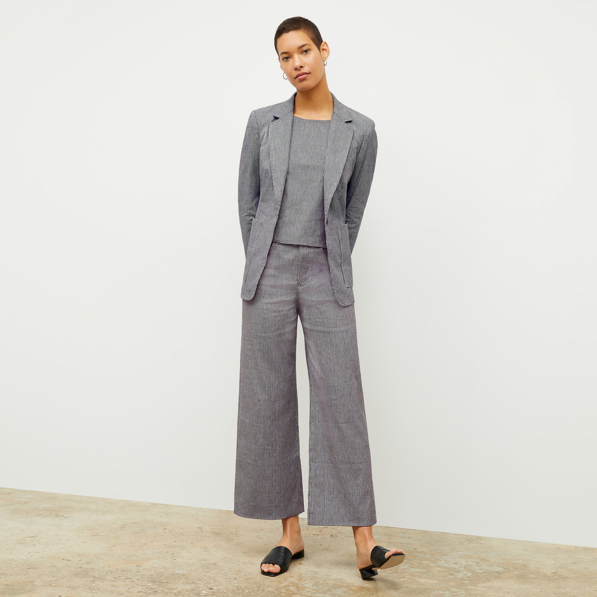 front image of a woman wearing the milo pant in gingham linen