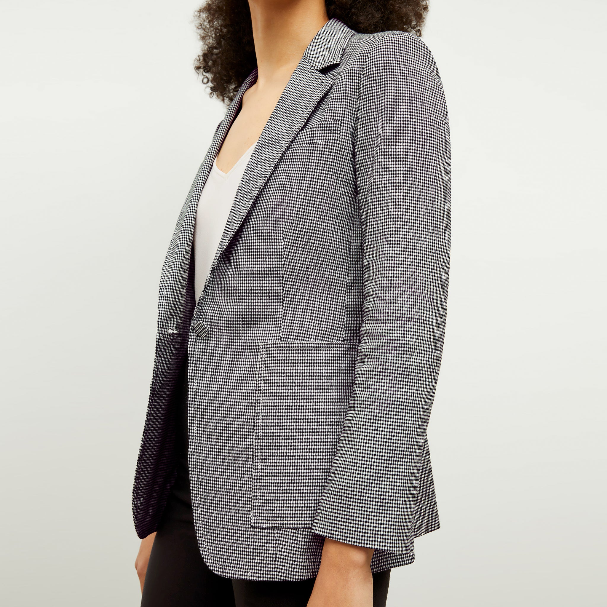 front image of a woman wearing the dolly jacket in gingham linen