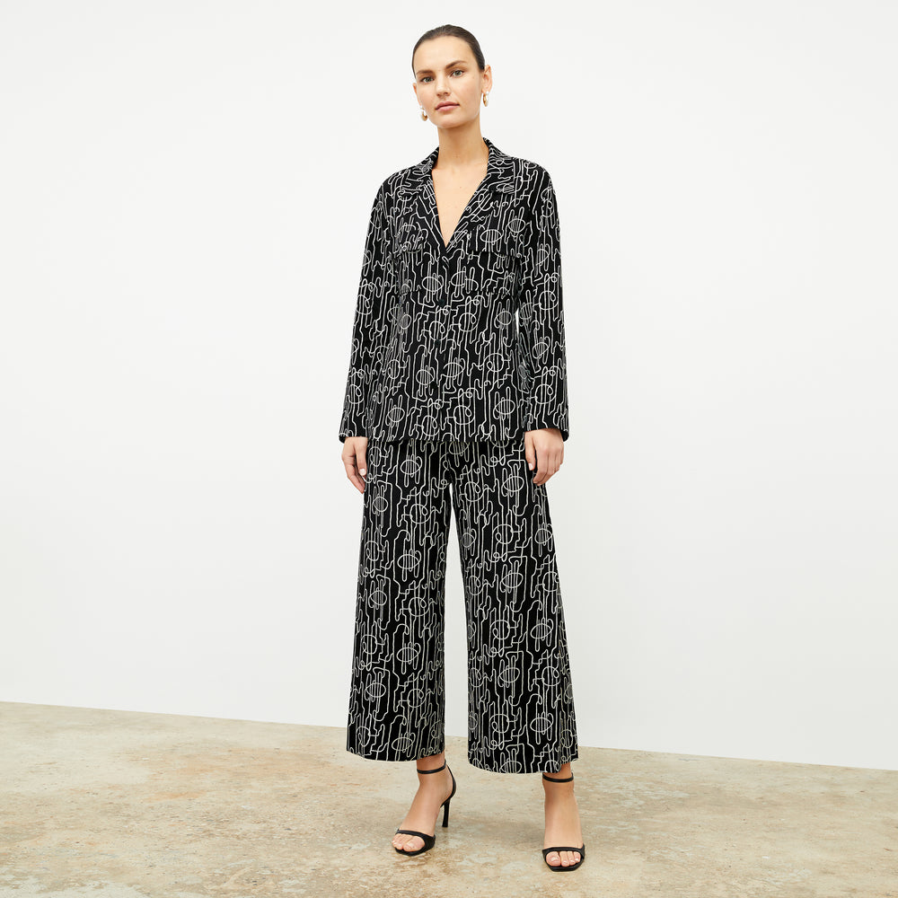 front image of a woman wearing the alyssa jacket in symphony print