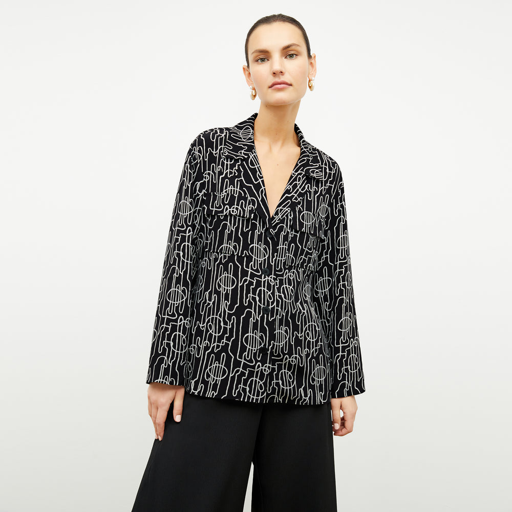 front image of a woman wearing the alyssa jacket in symphony print