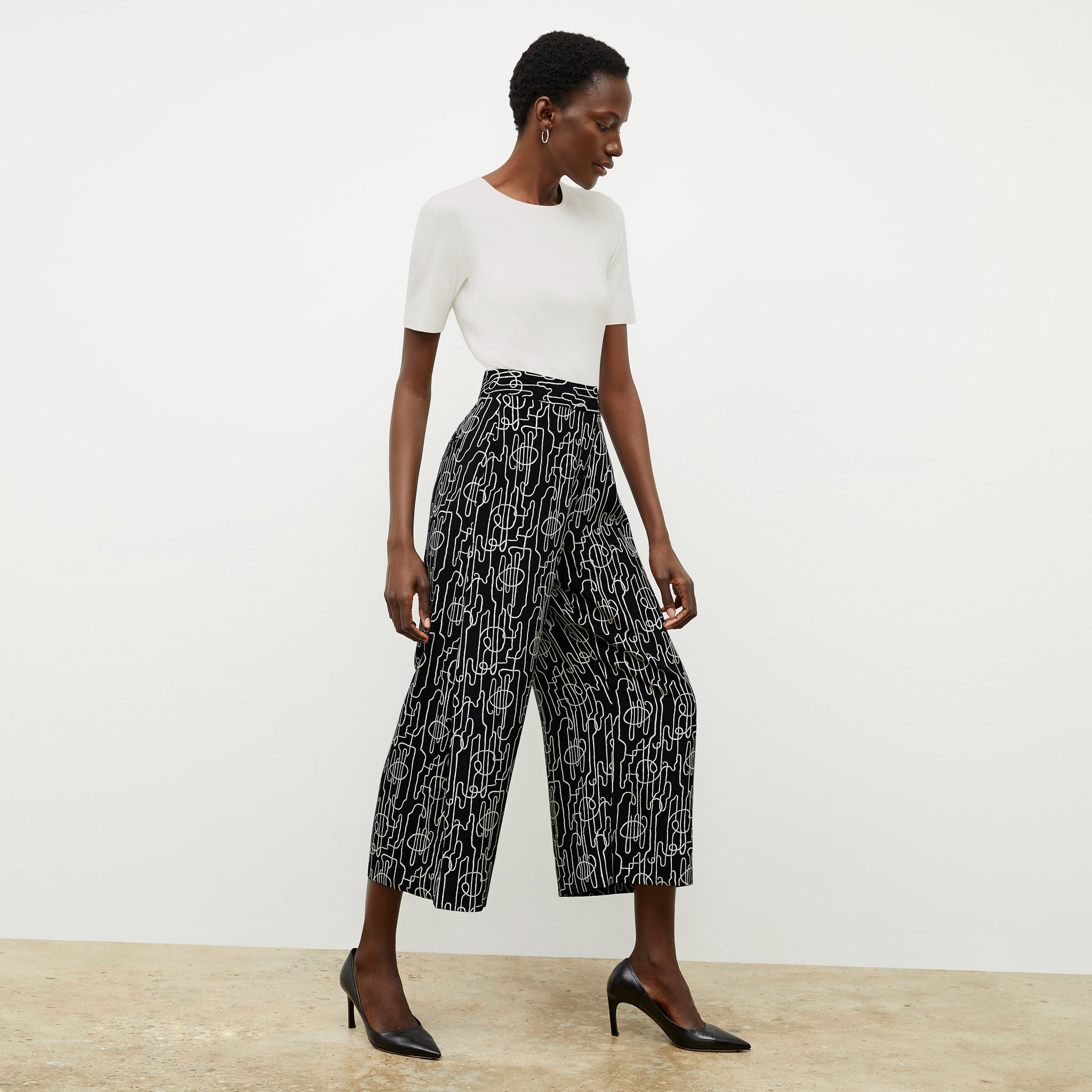 front image of a woman wearing the zhou culotte in symphony print 