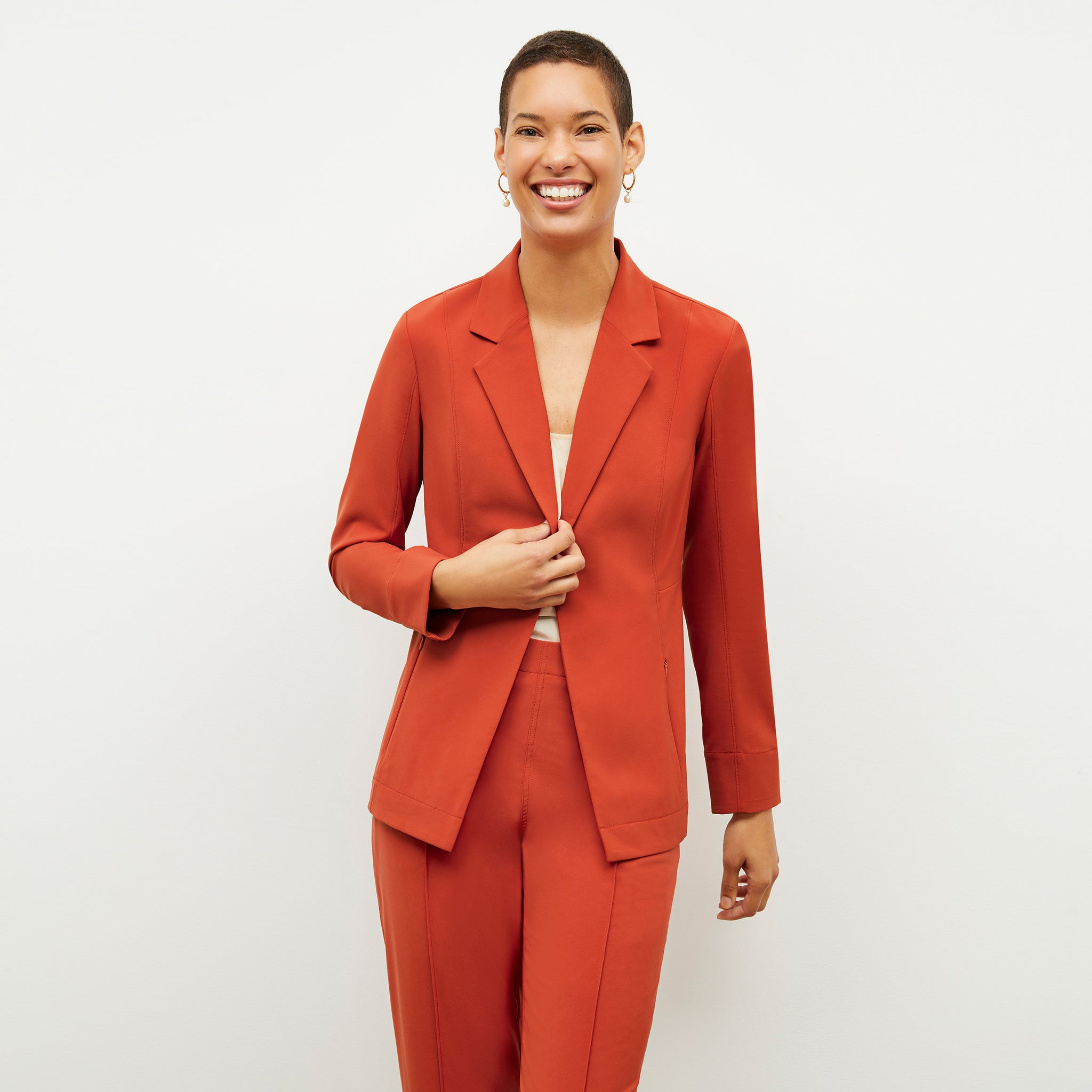 Front image of a woman wearing the Moreland Jacket in Blood Orange 