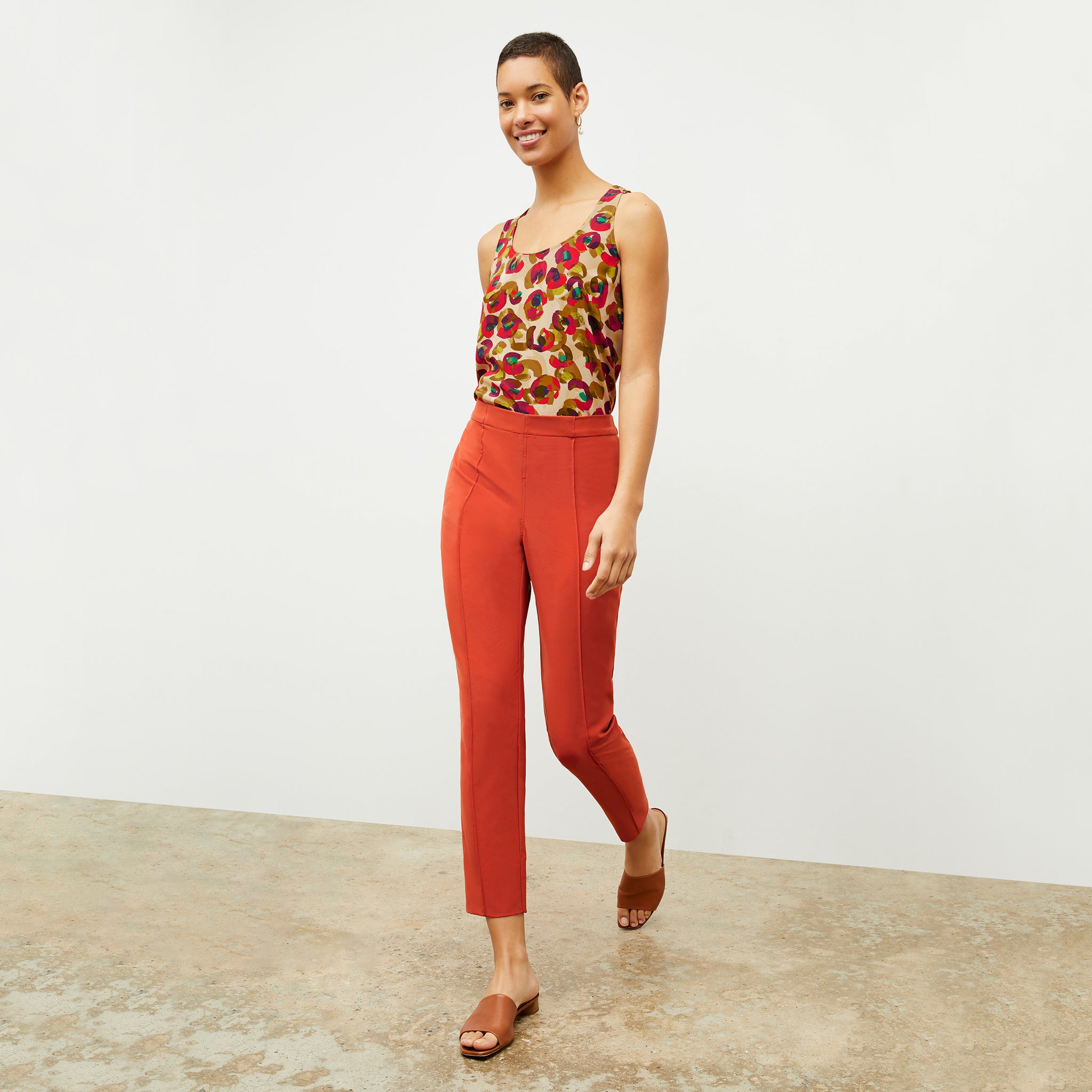 Front image of a woman wearing the Colby Pant in Blood Orange 