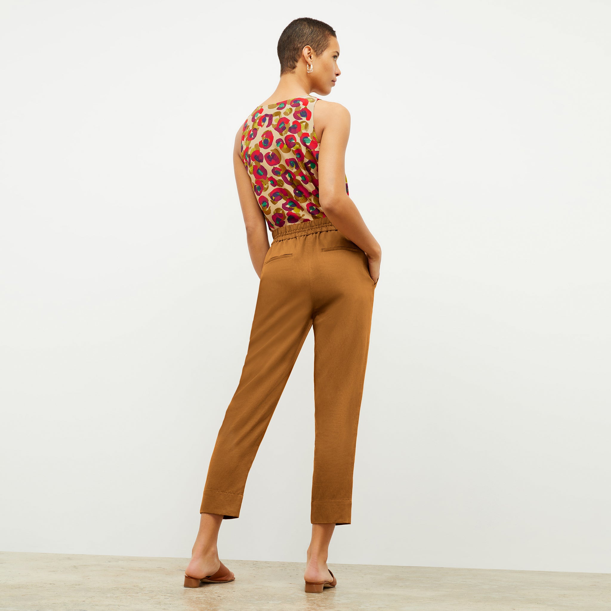Back image of a woman wearing the Shane Pant in Acorn 