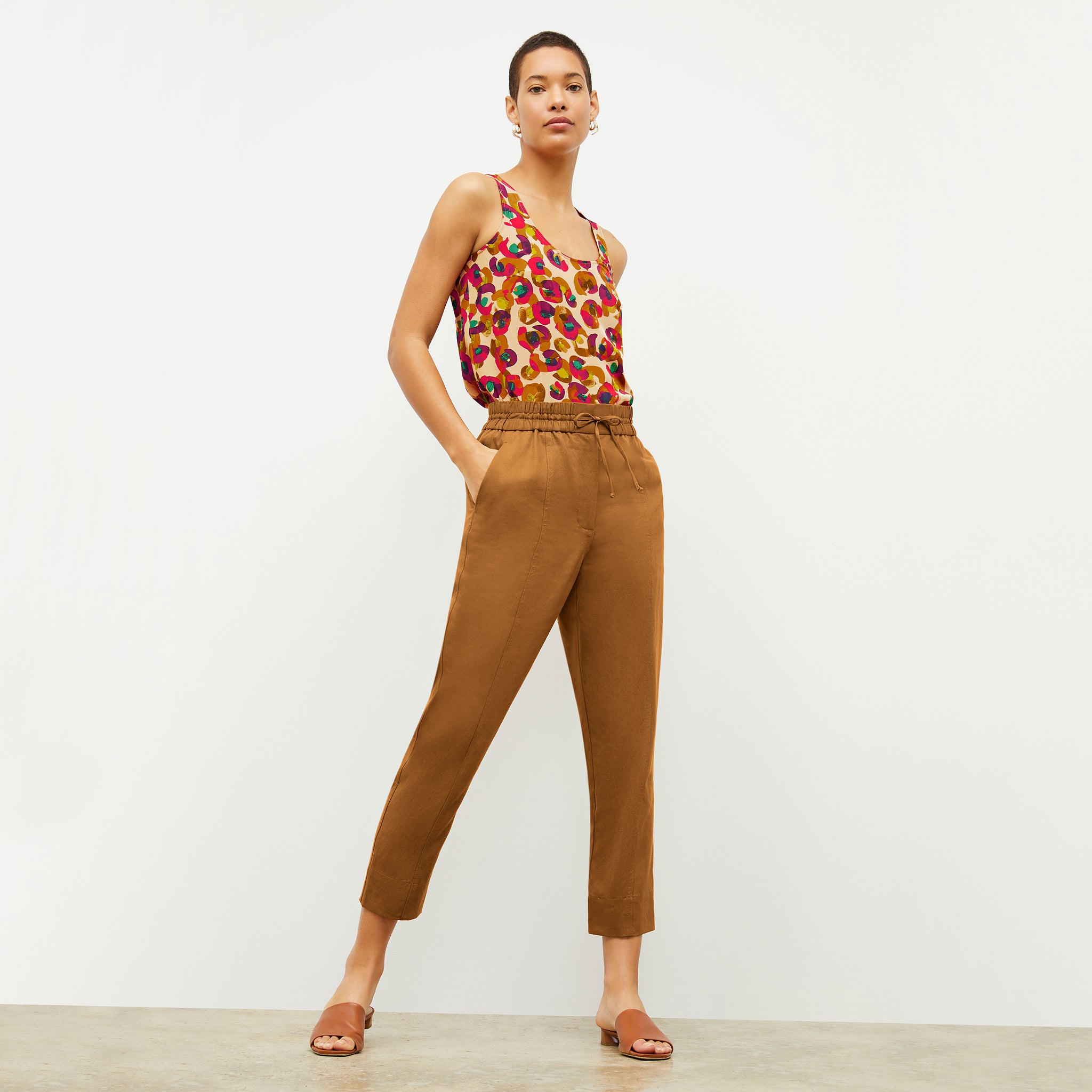 Front image of a woman wearing the Shane Pant in Acorn  