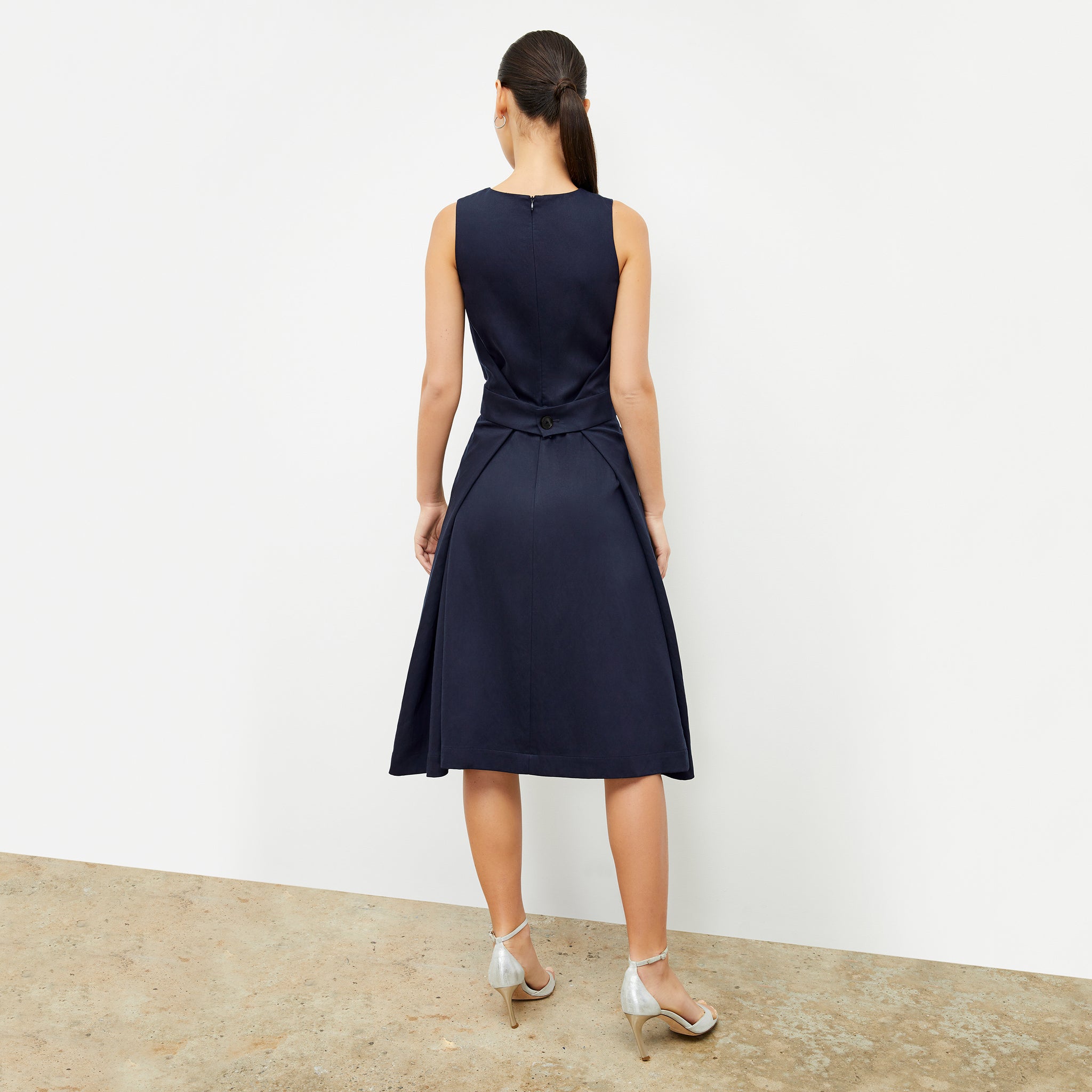 Back image of a woman wearing the Estela Dress in Night