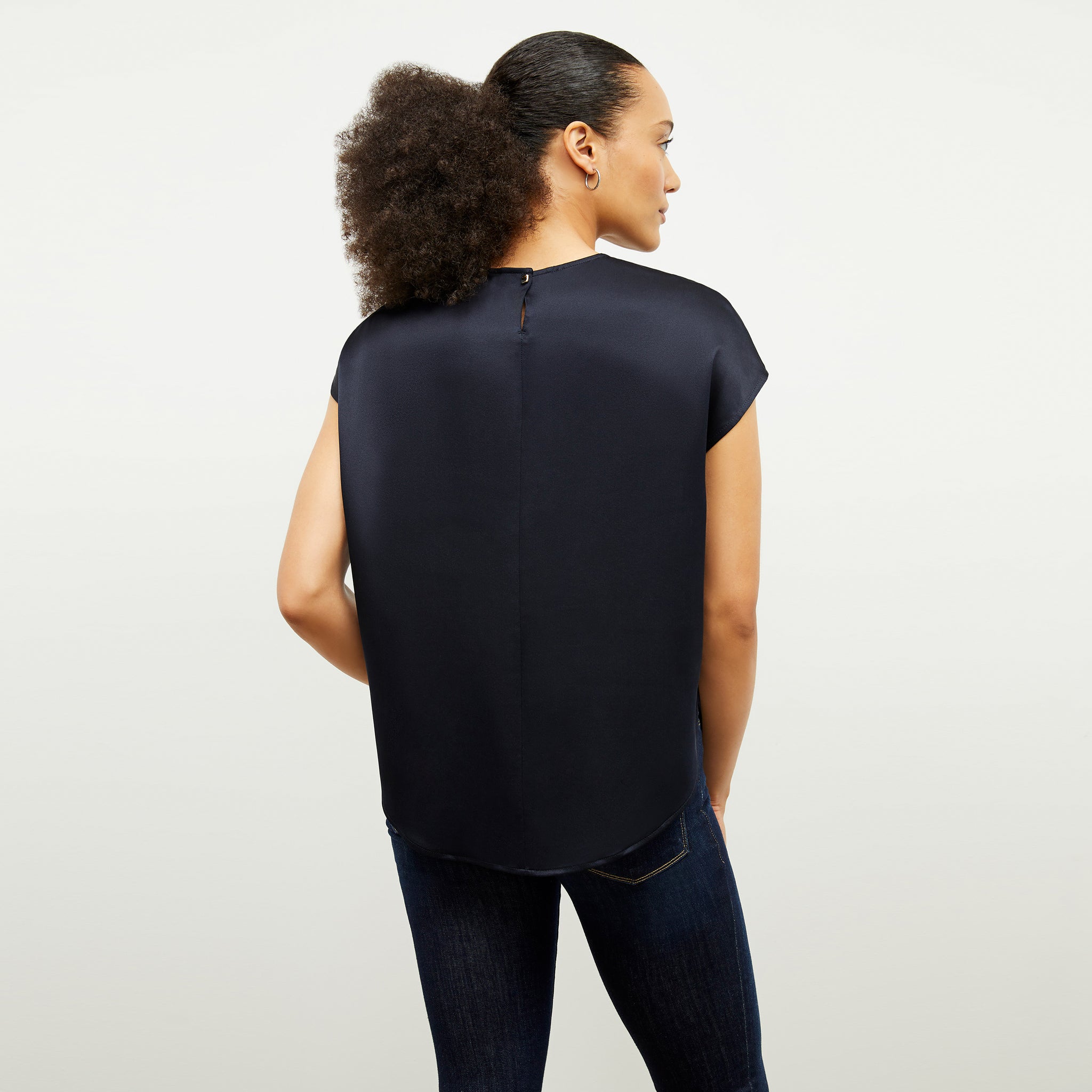 Back image of a woman wearing the Didion Top in Galaxy Blue