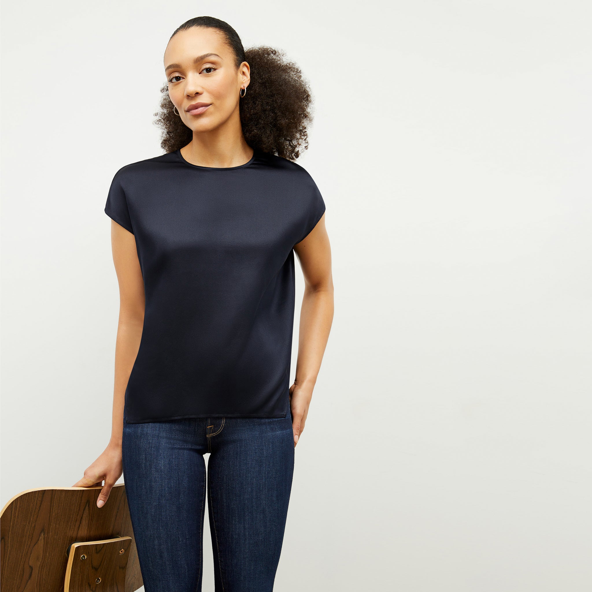 Front image of a woman wearing the Didion Top in Galaxy Blue 